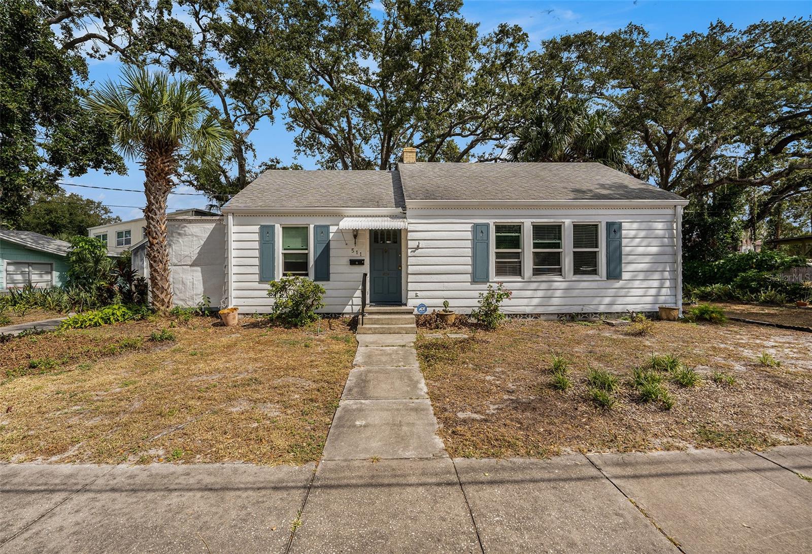 Attention Multiple Offers Recieved!  ALL offers due in writing by 5pm Friday Oct 31, 2025. Beautifully & meticously maintained this home is filled with timeless charm!  Formal foyer area with a convenient coat closet. Step into the spacious Living room featuring NATURAL WOOD FLOORS, Built-in Shelving & abundant Natural light streaming through DOUBLE-PANE Windows installed in 2019. The adjoining Dining room offers a CUSTOM Corner Cabinet, Ceiling fan & French doors leading to a comfortable screened-in porch — an ideal spot to unwind or enjoy morning coffee. 
Throughout the home, Classic Architectural details reflect its original character, including wide baseboards, crystal door handles, and the Craftsmanship you rarely find today. Both Bedrooms, along with the Dining & Living areas have Ceiling FANS for year-round comfort. The entire interior has been FRESHLY PAINTED in a clean, modern white, complementing the warmth of the WOOD FLOORS & Natural light.
Outside, you’ll find lush landscaping, winding walkways, and a lovely OPEN PAITO AREA for outdoor gatherings. A DETACHED GARAGE &  additional SHED provide great storage or workspace options. Major UPDATES offer peace of mind — including a Shingle ROOF in 2011 and a NEW CENTRAL AIR CONDITIONING System in 2025!
Located just minutes from downtown Clearwater, Coachman Park, the Public Library, Restaurants and so much more — this home blends classic character with everyday convenience.