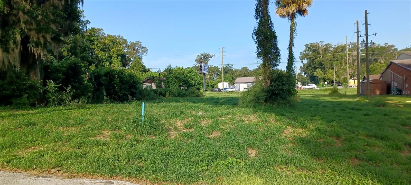 This 0.74-acre vacant commercial lot is ideally located in a high-traffic area, offering excellent visibility and easy access. Situated near major roads and local amenities, the lot is zoned for commercial use and is perfect for a variety of business ventures including retail, medical/office, or a quick-service restaurant.
The property features cleared land with no existing structures, providing a blank canvas for new construction. Utilities such as water, electricity, and sewer are available at the street, making it a cost-effective option for development. Surrounding businesses include established retail stores, fast food chains, and professional offices, creating a dynamic environment for any new commercial endeavor.
The lot is easily accessible by both foot traffic and vehicle, with ample parking potential for any future development. With its prime location and visibility, this lot is a fantastic opportunity for a business looking to establish itself in a growing commercial area.