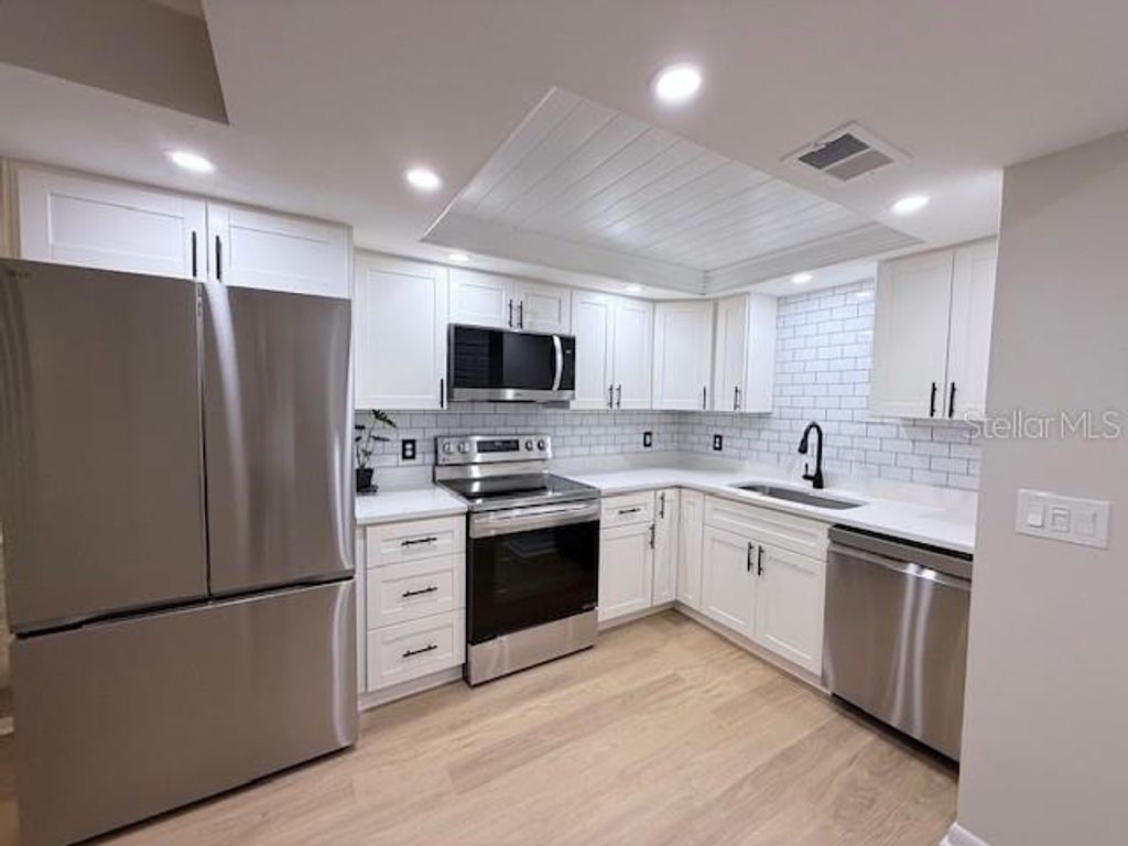 Photo of 1909 Whitney Way, Clearwater, FL 33760 (MLS # TB8448470)