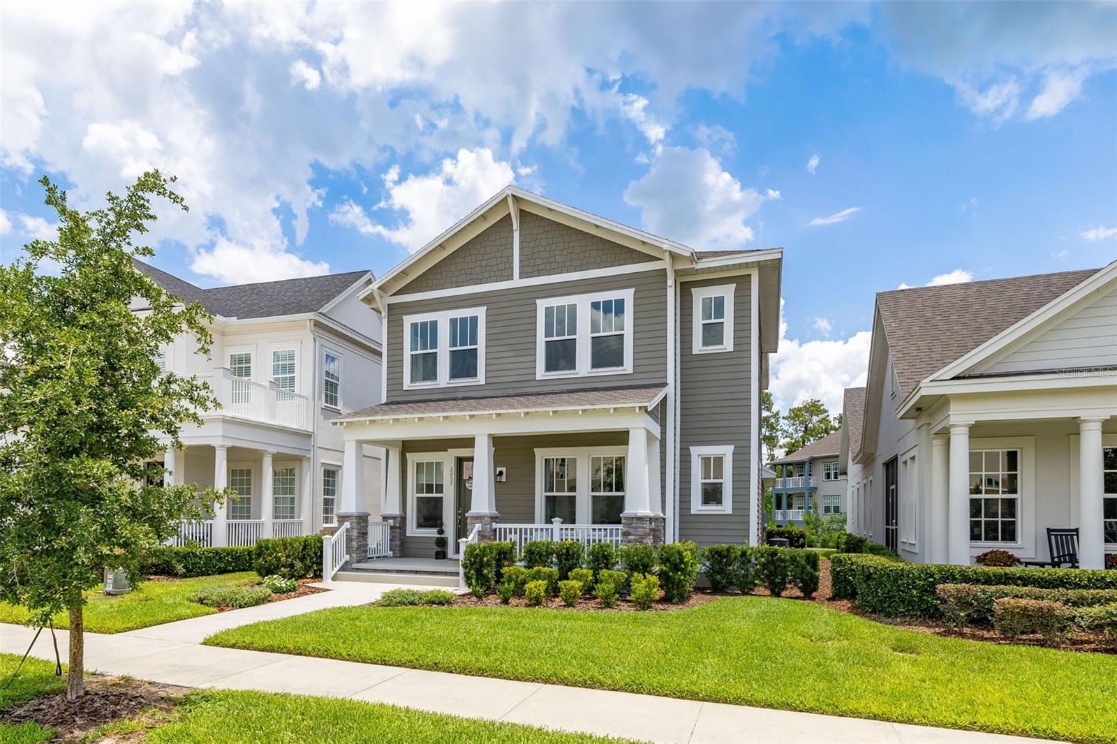 Welcome to an exquisite residence nestled in the heart of Island Village, Celebration. This elegant home offers an open and modern living experience with spacious flex and entertaining areas abound. LOCATED with CONSERVATION behind the property creating the beauty of nature. Step inside to discover a seamless blend of style and functionality. Upon entering the grand two story foyer entryway, one notices 12x12 ceramic tile flooring laid in brickwork vertical offset pattern, 5 inch baseboards, 8 foot high doors, dual pane windows and recessed lighting throughout. Just off the foyer is the first floor Office/5TH BEDROOM with walk in closets, the perfect flex space to suit your needs. Moving towards the heard of the home, one is greeted by the large living area with open floorplan design, plenty of natural light and ease of access to kitchen and outdoor spaces, an entertainers dream. The kitchen features alabaster colored 42 inch cabinets with brushed nickel pulls, pure white quartz counters with waterfall edge finish, blanco wave style subway tile backsplash and a single basin undermount sink with gooseneck faucet and filter tap. The stainless steel double oven, 4 burner gas stove, French door refrigerator and dishwasher complete this chefs paradise. The adjoining dining area and kids zone nook flows effortlessly making it ideal for both entertaining and cozy gatherings. Just off the dining area is the lanai overlooking the oversized side and backyard area, a premium in Celebration. As you head upstairs, the loft area provides a secluded hang out spot for those wanting a little getaway. The primary suite is adorned with tray ceiling with recessed lighting, oversized walk-in closet and primary bath perfected with gentlemen's height dual vanity, brushed nickel pulls, quartz countertops, square cut undermount sinks, dual handle faucets and walk-in shower with tile to the ceiling. Down the hall you'll find the secondary bathroom flanked by bedrooms 2, 3 and 4. The secondary bathroom is also embellished with gentlemen's height dual vanity, brushed nickel pulls, quartz countertops, square cut undermount sinks, dual handle faucets and tub/shower combo. Just one block from Downtown Island Village shops and restaurants, enjoy the community amenities, gym, pool and over 26 miles of Celebration's Nature Trails. This home also provides easy access to all that Celebration has to offer, only 1 mile to the new Shops at Celebration Pointe, 4 miles to Market Street, and less than 15 minutes to Magic Kingdom. This perfect blend of modern elegance and thoughtful design awaits your presence.