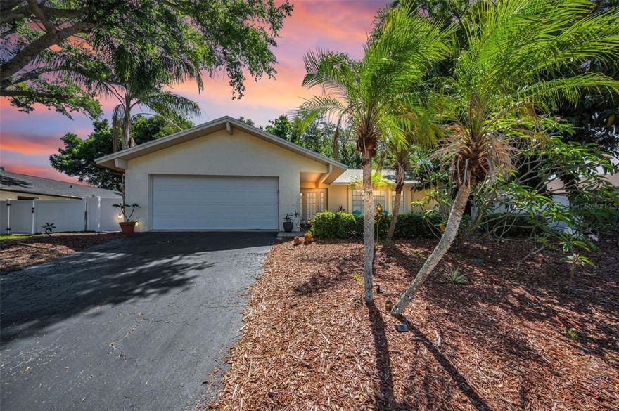 Located on an OVERSIZED LOT in a NON-FLOOD ZONE and move-in ready, this property is situated in WESTLAKE VILLAGE, one of PALM HARBOR’s most sought-after communities! Westlake Village is an established community known for its amenities and convenient location. This 3-bedroom, 2-bath home with a SPACIOUS 2-CAR GARAGE offers a comfortable layout with functional living space and Florida lifestyle appeal. Major updates include ROOF (2020), WINDOWS & DOORS (2019), WATER HEATER (2020), and POOL PUMP (2021), providing peace of mind for years to come. Inside, you’ll find a spacious layout, while the primary suite features an ENSUITE BATH and SLIDING DOORS leading directly to the lanai. The home also offers a LARGE ATTIC for additional storage. Step outside to a private backyard with a SCREENED-IN LANAI, POOL, and FULLY FENCED YARD designed for year-round enjoyment and entertaining. Residents of this community enjoy exceptional amenities including a community pool, clubhouse, scenic park, playground, and TENNIS, PICKLEBALL & VOLLEYBALL COURTS, along with WALKING TRAILS and a TRANQUIL LAKE—all within a GOLF CART-FRIENDLY NEIGHBORHOOD. This home is also ZONED FOR TOP-RATED SCHOOLS, including PALM HARBOR UNIVERSITY HIGH SCHOOL. This home is ideally situated in a community that offers direct access to the PINELLAS TRAIL from the neighborhood park, making it easy to enjoy biking, walking, and running. Just minutes from the Palm Harbor YMCA and the Palm Harbor Recreation Center, currently undergoing major renovations and improvements, residents can enjoy a wide variety of recreational programs, sports, fitness activities, and community events nearby. It is also approximately 5 miles from HONEYMOON ISLAND STATE PARK, where you can enjoy pristine Gulf beaches, nature trails, and breathtaking sunsets. About 14 miles away is CLEARWATER BEACH, renowned for its powdery sand and crystal-clear waters and approximately 22 miles to Tampa International Airport for easy travel. Enjoy the best of Palm Harbor living in a prime location within this sought-after community.