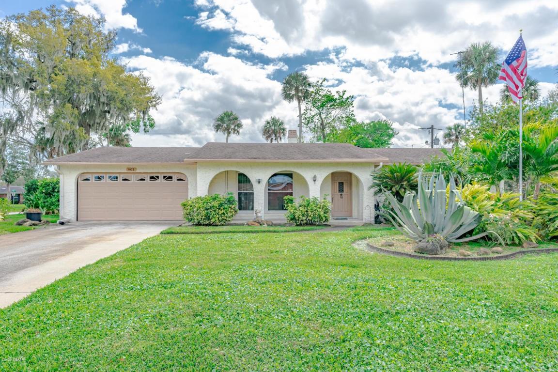 Beautiful Corner Lot Home with exceptional Landscaping front and back. 3 Bedroom/2 Bath with Formal Dining and Living Area with Porcelain Tile. Kitchen, Family and Hallways with Ceramic Tile Flooring and Fireplace to keep you warm in our cold winter nights. Breakfast Bar area for early morning coffee while watching your favorite morning show. Sliders from Family Room lead you to a Screened Lanai and large fenced back yard with lush landscaping and plenty of room for the kids and pets. New Ceiling Fans throughout; Skylights are heat resistant glass, Double Pane Windows with Argon Gas. AC with Special Dehumidifier Program. Inside Laundry Room. Solar Lighting Outside Front and Back. Well for your Irrigation to keep your lawn beautiful.
All Measurements and Information deemed to be accurate but cannot be guaranteed, Buyer/Realtors are advised to verify. ;Water: City
