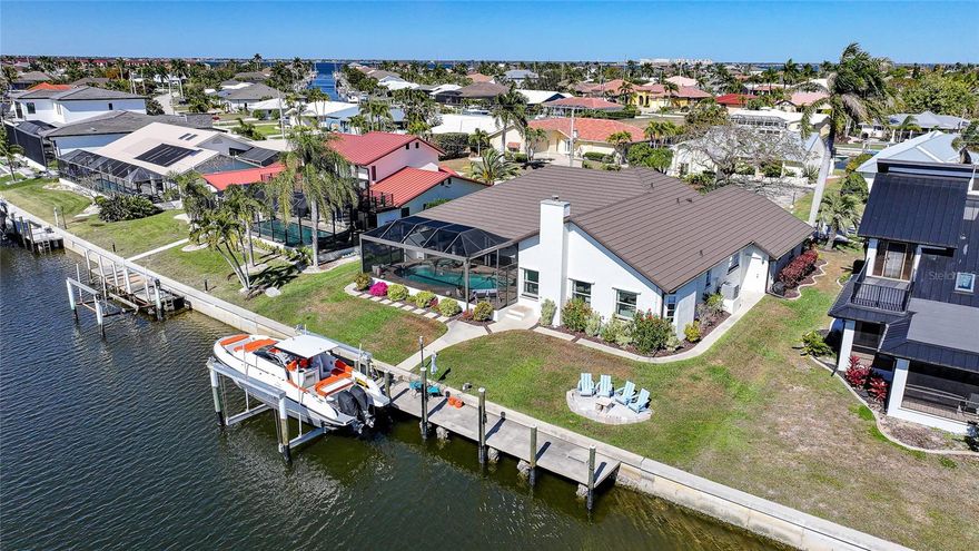 QUICK SAILBOAT / GULF ACCESS, UPDATED POOL HOME FOR SALE WITH WIDE BASIN VIEWS IN THE HEART OF Punta Gorda Isles. 

Welcome to 131 Hibiscus Dr — a refined, waterfront residence that perfectly captures modern coastal luxury. Positioned on a saltwater canal with NO FIXED BRIDGES and just a short cruise to open water, this property offers the boating lifestyle serious enthusiasts demand, and has been designed for effortless days on the water. Wide basin views provide both privacy and stunning water vistas rarely found in canal homes.

Since 2022, this home has undergone an EXTENSIVE, high-end transformation (such as a NEW ROOF), delivering a clean, sophisticated aesthetic throughout. The reimagined chef’s kitchen is a true showpiece, featuring sleek QUARTZ COUNTERTOPS, all-new CUSTOM CABINETRY, premium appliances, and a seamless flow into the main living areas — ideal for entertaining or quiet evenings overlooking the water.

New DESIGNER FLOORING runs throughout the residence, complementing the freshly painted interior and creating a cohesive, modern palette. Both bathrooms have been COMPLETELY REDONE with elevated finishes, offering spa-like comfort and timeless elegance. Every detail reflects quality, intention, and refined taste.

The open-concept layout maximizes natural light and WATER VIEWS, while disappearing sliders create a seamless indoor-outdoor experience. Step outside to your private resort setting: a heated pool and spa with a NEW POOL HEATER, expansive lanai space, and a fully equipped OUTDOOR KITCHEN — perfect for hosting waterfront gatherings, sunset dinners, and year-round Florida entertaining. Tranquil basin views create an unforgettable backdrop for luxury outdoor living.

Additional upgrades include a NEW A/C SYSTEM (2022), ensuring comfort and efficiency year-round, along with thoughtful improvements that make this home truly move-in ready.

The oversized garage provides ample room for vehicles, storage, or hobby space — a rare and valuable feature in waterfront properties.

This is more than a home — it’s a statement. A meticulously updated, modern waterfront retreat offering luxury finishes, premier boating access, outdoor entertaining space, and wide water views in one of Punta Gorda’s most desirable boating communities.

Schedule your private showing and experience elevated waterfront living.
