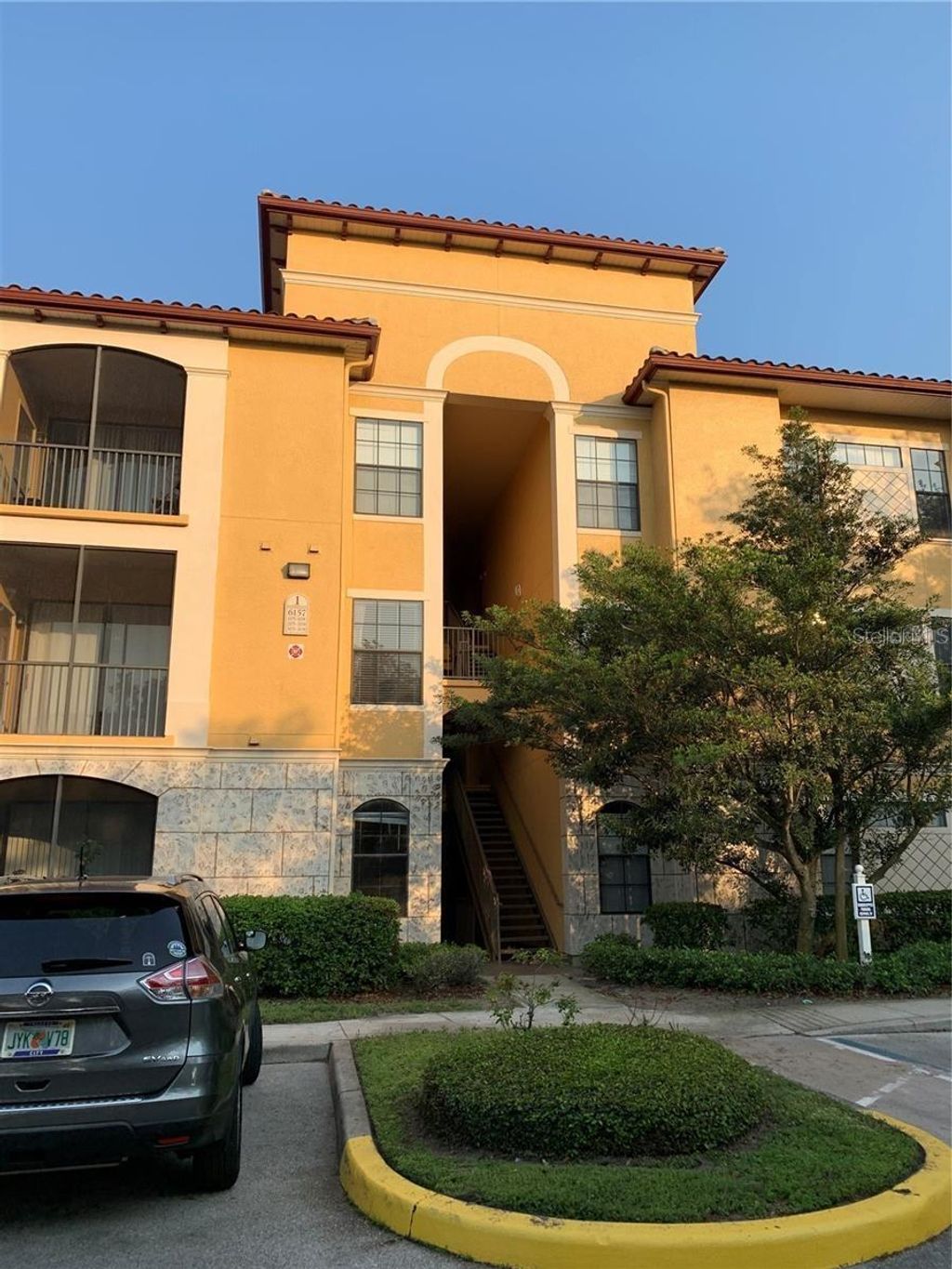 Photo of 6157 Metrowest Boulevard #101, Orlando, FL 32835 (MLS # O6374730)