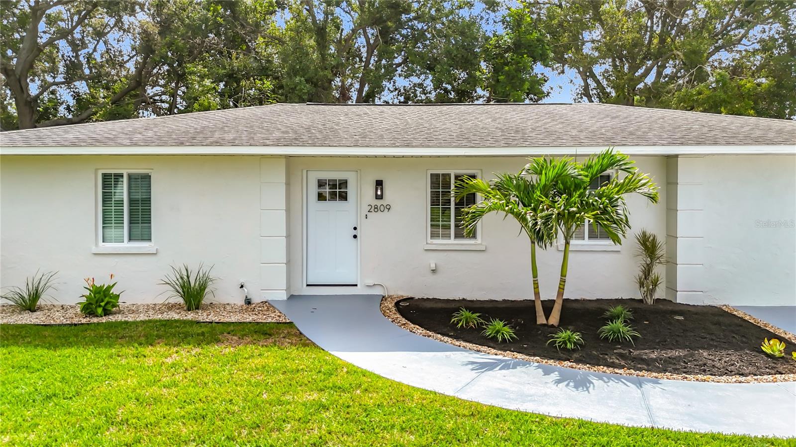 MUST SEE FULLY RENOVATED TURN-KEY RANCH-STYLE HOME in West Central Bradenton! This 3 bedroom, 2 bathroom open-floorplan home, with no deed restrictions or HOA fees, is recently renovated with NEW EVERYTHING! The entrance to this beauty greets you with a re-imagined and freshly-painted front elevation accentuated by new landscaping, and welcomes you in with an abundance of natural light complete with clean, crisp finishes including fresh interior paint throughout, quartz countertops, stainless steel appliances, a subway tile kitchen backsplash, solid wood cabinetry and durable LPV flooring throughout. With a Florida room that leads out to a large covered patio and a fully-fenced backyard perfectly situated for a pool and outdoor kitchen, this home is perfect for Florida living, family gatherings and entertaining! With an oversized shed in the backyard, all your storage needs are satisfied! The fully enclosed laundry room, complete with a full-size washer and dryer, can double as a mudroom after work or school or a day of Florida outdoor living. Both bathrooms are immaculately renovated with upgraded vanities and lighting, and the primary bathroom boasts a gorgeous glass shower enclosure. Solar energy has been installed and paid in full! Conveniently located 20 minutes from SRQ airport, near the Pirates Spring Training stadium, the beautiful west coast beaches, shopping, and dining, this gem is the perfect southwest Florida abode! Don’t miss out on this amazing opportunity!