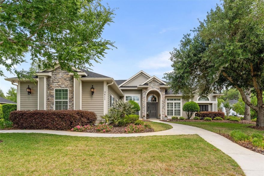 Meticulously maintained pool home located in the highly desirable community of Turnberry Lake. Situated on a half acre corner lot, this three- way split floor plan offers 4 bedrooms, 3.5 bathrooms PLUS office/study and almost 2,700 square feet of conditioned living space. Inside, soaring 12' entry and 10' ceilings throughout, rich wood flooring, and extensive trim details including crown molding, plantation shutters, chair rail, picture molding, and coffered ceilings, create a refined yet inviting atmosphere. The formal living room flows directly into the formal dining room, creating an open, connected space that works well for entertaining. At the heart of the home is a well-appointed kitchen showcasing custom wood cabinetry, granite countertops, stainless steel appliances, five-burner gas cooktop, double ovens, and a large center island with separate wine cooler. Just off the kitchen, a breakfast nook with built-in bench seating offers a comfortable spot for everyday meals, while the adjoining family room feels warm and welcoming with its custom built-ins, stacked stone gas fireplace and coffered ceiling. The spacious primary suite features a tray ceiling, dual walk-in closets with custom closet systems, and French doors leading to the screened lanai. The en suite bath includes dual vanities, jetted tub, walk-in shower, and private water closet. Just off the primary suite, you’ll find a dedicated office/study, along with a conveniently located half bath that also provides direct access to the pool area. Two additional guest bedrooms on the opposite side of the home are equally spacious and share a full bath with dual vanity. Set down its own hallway, the fourth bedroom and full bath offer a private setup that works well for visiting guests. Step outside to enjoy Florida living year-round on the screened lanai, complete with a heated pool and spa, as well as a built-in vent hood for a gas grill-perfect for outdoor gatherings. Recent updates include roof (2026), spa heater (2026), Kohler 26kW whole-house generator (2025), tankless gas water heater (2025), variable speed pool pump (2024) and recent interior as well as exterior painting. Additional highlights include a 3-car side entry garage, dedicated laundry room with utility sink, insulated low-E windows, and high-speed fiber internet through IQ. Energy efficiency is enhanced with natural gas, Clay Electric service and a dedicated well for irrigation.  Turnberry Lake residents enjoy a community pool and playground, miles of sidewalks, and a private 10-acre lake for "catch-and-release" fishing. Ideally located just steps from Jonesville Rotary Park-featuring baseball and soccer fields, as well as clay tennis courts, only minutes from Tioga Town Center and easy access to the University of Florida, as well as UF Health and HCA hospitals by way of I-75.