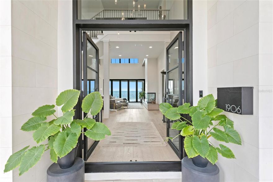 This St Pete home known as Casa Azul was inspired by the panoramic waters of Tampa Bay and is a true team collaboration of great friends and great design. As the name suggests Casa Azul is quite simply THE MOST STUNNING waterfront home with unparalleled and sweeping views of Tampa Bay, downtown St. Pete and the Skyway Bridge.  The owners were inspired by this premier lot and wanted every room to highlight their connection to the 142 ft of waterfront.  Each selection from the finishes, flooring, lighting, textures, and furniture flow and glow like your favorite piece of art.  Working with their close friends as the designers and builders allowed and ensured that every detail and every selection was going to be well thought out, well designed, and well done. The overall feel is a sense of luxury, relaxation, and natural beauty of all the elements.  A 5,516 sqft house with 5 bedrooms, 6 bathrooms, RH lighting, Savant whole home automation for lights, blinds, music with 50+ speakers this home is one of the best we've ever had the privilege to represent.  Top of the line appliances in the kitchen - Subzero, Wolf, and Bosh with a hidden pantry with ice machine, extra prep and storage space and close access to garage commercial ice machine and freezer.  Extra storage in the garage with automatic remote controlled lifts.  Additional luxuries include extra climate-controlled storage, a whole house water filtration system, and a 180-bottle walk-in wine room and humidor featuring custom built wine racks, a climate control system, and ambient lighting that makes it elegant and functional.  Fireplace in both living room and primary,  full gym, sauna, cold plunge and two levels of outdoor living space to include an infinity pool, extra large and oversized covered hot tub, outdoor kitchen and bar.  A second floor bar/ lounge with a pool table, art TV, and large balcony becomes another great entertaining space.  A commercial grade dock and 40K lb high speed lift and jet ski lift.  We have two pages of features to share so call, text or schedule a showing TODAY!  A property like Casa Azul comes along once in a lifetime so contact me to schedule a showing to see it for yourself.