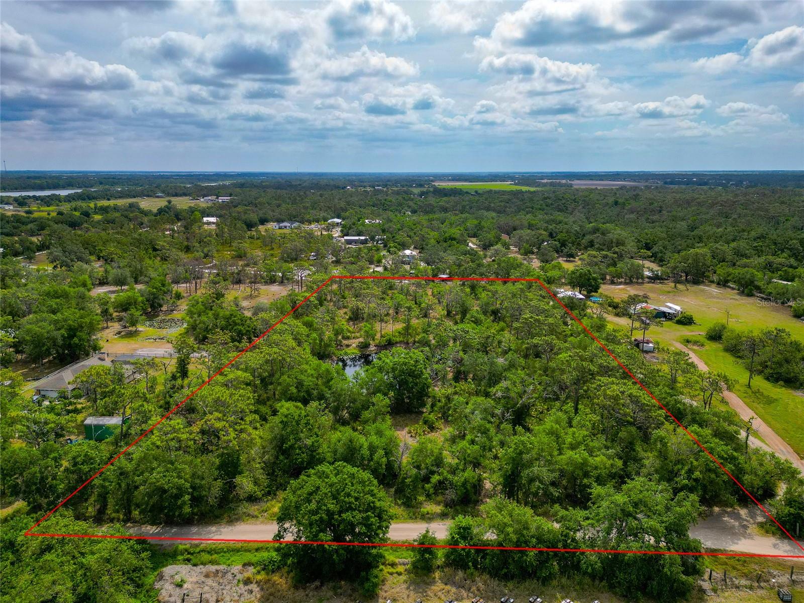 Incredible wooded 5-acre lot with pond located in Bradenton, FL. This property is conveniently located close to Lake Manatee State Park, and also close to the amenities of Lakewood Ranch. The recent improvements to the property include a newer split rail wood fence on the eastern boundary of the lot, access road cleared on south side of the lot providing access to the perfect spot to build your dream home, and new survey. This is a unique opportunity to get a large parcel located in Bradenton with no HOA or deed restrictions. Schedule your showing today!!!