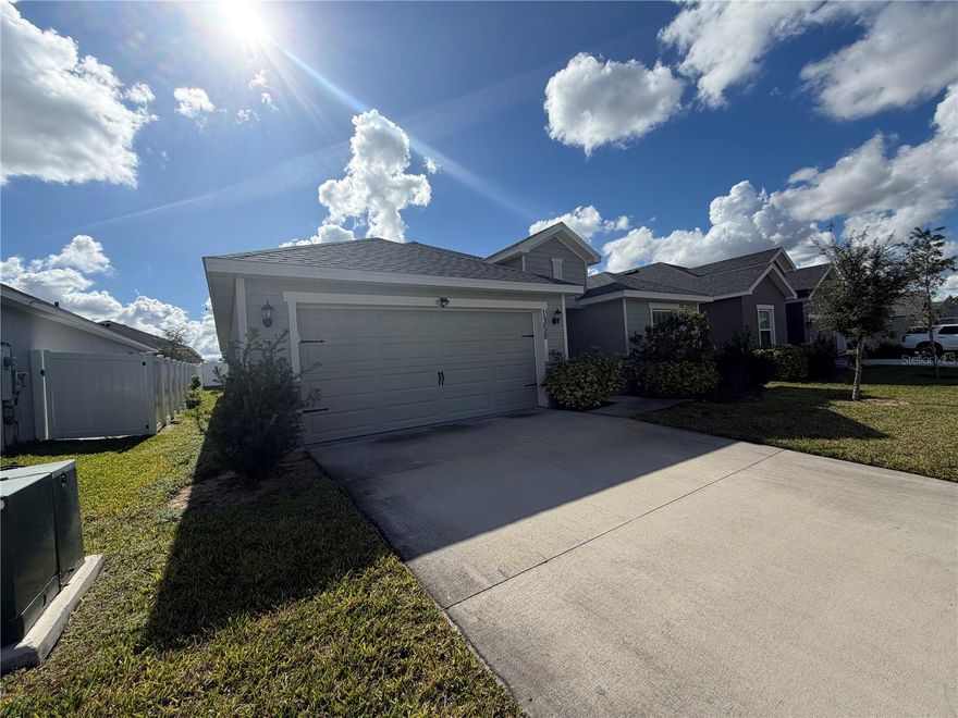 Welcome to this stunning 2023-built residence, perfectly situated in Davenport to give you the ideal balance of modern luxury and commuter convenience. The home features an expansive open floor plan highlighted by soaring vaulted ceilings and a chef-inspired kitchen complete with a large island, sleek quartz countertops, and an easy-to-clean backsplash. The primary suite serves as a true retreat, boasting a spacious walk-in closet and a luxurious en-suite bathroom with a private water closet. With four generous bedrooms, there is ample flexibility for a dedicated home office or guest space. 2 car garage for easy storage for your belongings and vehicles. The garage and front door are smart and able to be operated from the ease of your phone. You have a sidewalk in this community! Enjoy the outside Florida breeze in your screen enclosed back porch. Located just a breezy 4-mile drive from the premier shopping and dining at Posner Park, and only 4.1 miles from I-4 and nearby 17-92 and 429, you’ll enjoy effortless access to Disney World, Universal Studios, and the greater Orlando area.