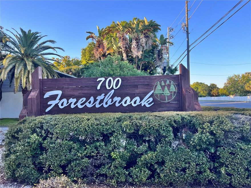 Beautifully updated and thoughtfully designed, this ground-floor condo offers 1,450 square feet of comfortable living space, plus a spacious wraparound screened lanai—perfect for relaxing or entertaining. Inside, you’ll find a bright and inviting layout featuring a 2025-updated eat-in kitchen with pantry, along with tastefully renovated bathrooms. The living room includes a wet bar, creating an ideal space for hosting family and friends. The split-bedroom floor plan provides privacy and flexibility, making this home well-suited for any lifestyle, with no age restrictions. The oversized primary suite boasts abundant space, including an impressive 6' x 10' walk-in closet. Neutral ceramic tile and Berber carpet throughout create a warm, versatile backdrop ready for your personal touch. Additional highlights include an inside laundry room, two storage closets (one equipped with a second refrigerator), and a covered one-car carport. Major updates include a new A/C in 2022 and all new double-pane vinyl windows in 2023. Ideally located just across the street from one of Forestbrook’s two heated pools, this light-filled, spacious condo offers both comfort and convenience. This is a home you won’t want to miss—schedule your private showing today!