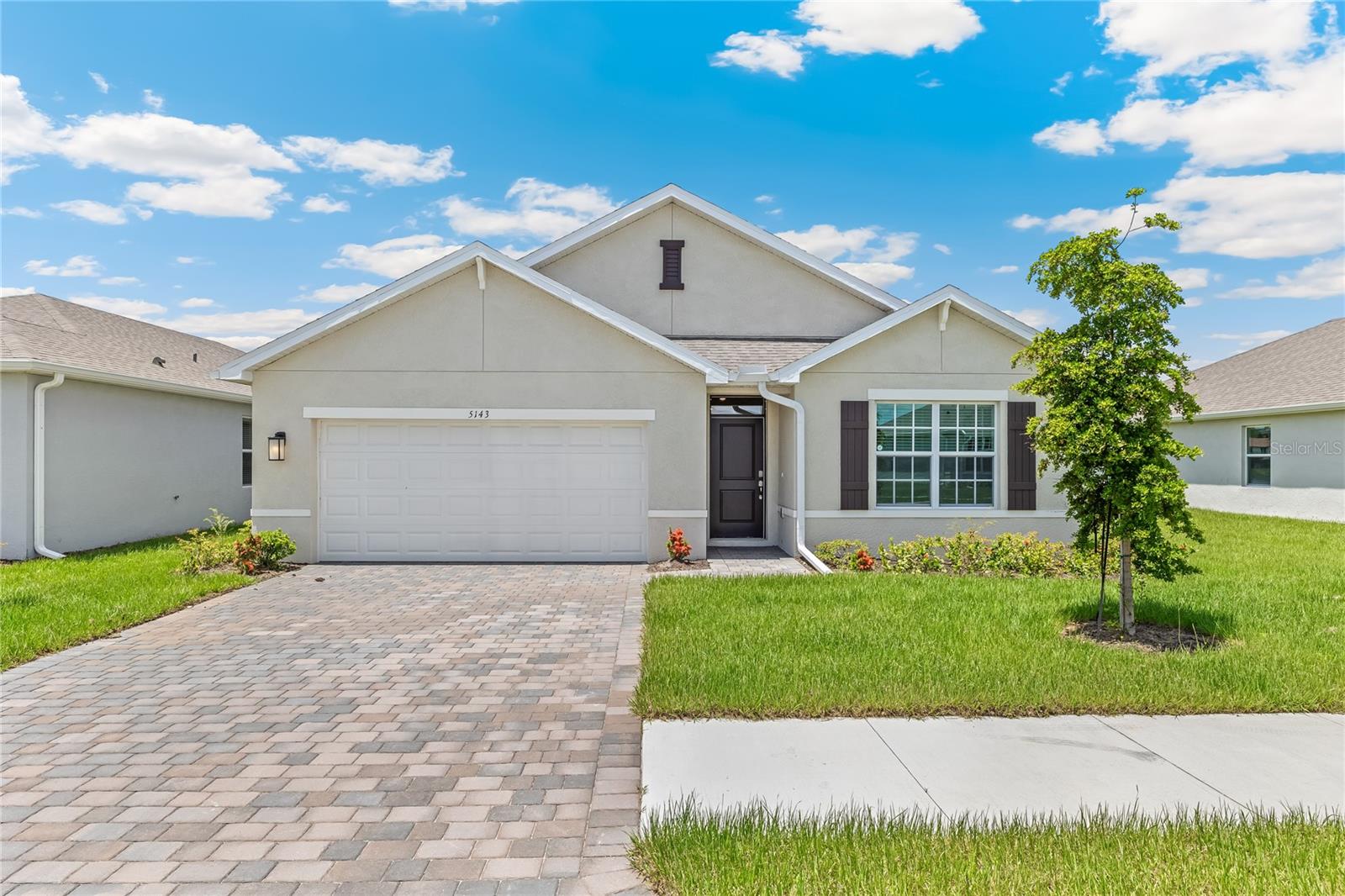 Welcome home to our beautiful Cali floorplan. Appealing one-story home includes impact windows and all appliances. The well-appointed kitchen includes a large island with quartz counter tops with a single bowl sink, perfect for bar-style eating or entertaining. A walk-in pantry with plenty of cabinets and counter space. The dining room and living room both overlook the covered lanai. The large primary bedroom located at the back of the home for privacy, can comfortably fit a king-size bed, and includes a bathroom with double vanity and
quartz counters. Boasts a big walk-in closet and separate linen closet. Split floorplan with two bedrooms and the third bedroom can act as a den or flex room. The two-car garage connects to the front hallway where the laundry room and an extra storage closet. Located off of a cul-de-sac. Great pond view. Home ready now!