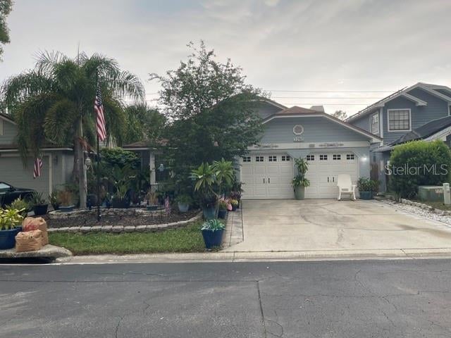 Photo of 2250 Springwood Cir W, Clearwater, FL 33763 (MLS # TB8530034)