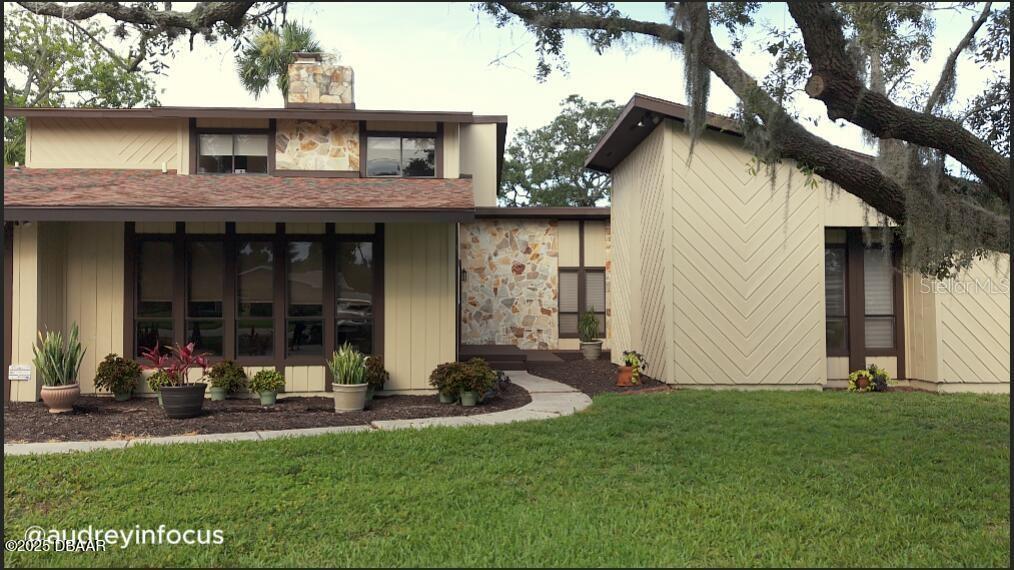 Stunning Home in an Excellent Location! Welcome to this beautiful 3/4 bedroom, 3-bath home nestled in one of the most sought-after neighborhoods. Thoughtfully designed with spacious living in mind, this home offers a perfect blend of comfort, style, and function. It is just minutes from downtown Ormond Beach and beachside activities. Step into the oversized living and dining rooms—perfect for entertaining or simply relaxing with family. A gorgeous pass-through stone fireplace adds warmth and charm, creating a cozy ambiance that can be
enjoyed from both the dining area and the inviting living room. The large, eat-in kitchen offers ample space for cooking and gathering, making it the heart of the home. In addition, there is a large family room for separate enjoyment. Retreat to the luxurious primary suite featuring a custom-designed bath with a spa tub, separate shower, and elegant finishes that make it your own private oasis. Generously sized bedrooms offer flexibility, whether you need a fourth bedroom, office, or guest space. Start your mornings with peace and tranquility on your private deck—ideal for sipping coffee and soaking in the quiet surroundings. The expansive backyard has a brand new deck and a brand new fence. It is a perfect place for a backyard BBQ or watching the pets play. There is plenty of room on the side of the house to store your play toys, like a jet ski, boat or van. The two car garage has plenty of storage. This home truly has it all—ample space, elegant features, and a location that can’t be beat. Don’t miss your opportunity to make it yours!
