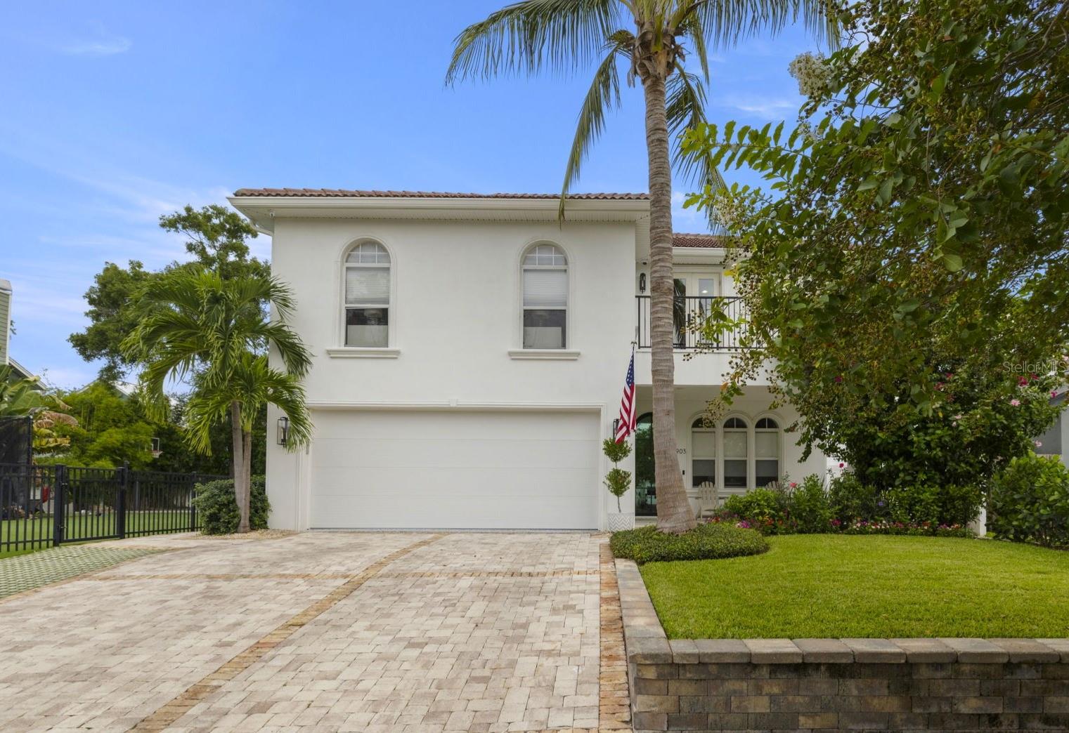 This beautifully maintained 2-story residence combines timeless curb appeal with modern comforts. A custom iron front door, manicured landscaping, and spacious driveway with a 2-car garage welcome you home.
Inside, the formal dining area sets the stage for entertaining. The open-concept kitchen flows seamlessly into the living room, where a cozy gas fireplace and custom built-in shelving create a warm, inviting atmosphere. The kitchen is designed for both function and style, featuring a center island, walk-in pantry, and a coffee/wine bar complete with an icemaker. Enjoy views of the backyard oasis from the main living spaces.
Upstairs, you'll find four comfortable bedrooms and a convenient laundry room. Two bedrooms share a Jack-and-Jill bath setup, while the private primary suite includes a versatile office nook, two separate walk-in closets, and a spa-like en suite bath with a walk-in shower and soaking tub.
Step outside to your own retreat, complete with a covered sitting area, spacious patio, and a sparkling pool surrounded by lush landscaping, perfect for outdoor gatherings year-round.
Located in the heart of South Tampa, this home offers the best of Florida living, Modern amenities, outdoor entertaining, and a highly sought-after neighborhood.