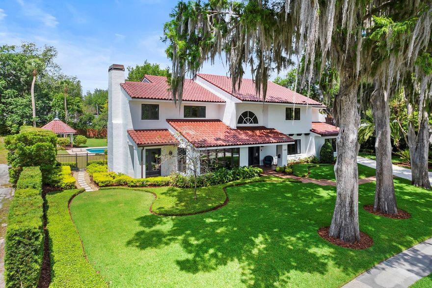 Amazing opportunity to own a lakefront home on Lake Virginia footsteps from Rollins College, nestled in walking distance to downtown Park Avenue shops and restaurants, and located on the coveted Chain-of-Lakes! A magnificent five-bedroom, four-and-a-half-bath home offers breathtaking lake views, capturing the essence of Florida living at its finest. This sprawling 5,600-plus square foot residence sits on an expansive .84-acre lot with a huge backyard, gracing a charming brick street, and includes an additional parcel across the street, featuring a covered boat dock/lift, ensuring endless days of waterfront lifestyle enjoyment. Step inside to discover an impressive layout designed for both grand entertaining and comfortable living. Generously sized rooms include formal living and dining areas, a cozy den/library, and a sprawling 18-by-27-foot family room seamlessly connected to the centrally located kitchen. Enjoy the sun-filled 40-by-16-foot Florida room, featuring two sets of sliding glass doors that open to the pool and lush backyard. The second floor features the primary suite with beautiful lake views, a spacious ensuite bath and two large walk-in closets. Three additional bedrooms grace this level, one with a private bath and two sharing a Jack and Jill bath, providing ample space for family and guests. A convenient fifth-bedroom suite on the first floor offers versatility, ideal for guests, a nanny, or an in-law retreat. Step outside to your private paradise, complete with a putting green, gazebo, expansive lawn, and a tropical pool perfect for refreshing dips on warm summer days. With a spacious driveway and a three-car attached garage, there's plenty of room for parking and storage. Location is key, and this home delivers. Again, enjoy the convenience of being steps away from Rollins College and within walking distance to the charming boutiques and eateries of Park Avenue. Don't miss your chance to own this exceptional lakefront estate property, where every day feels like a vacation. Schedule your private tour today!