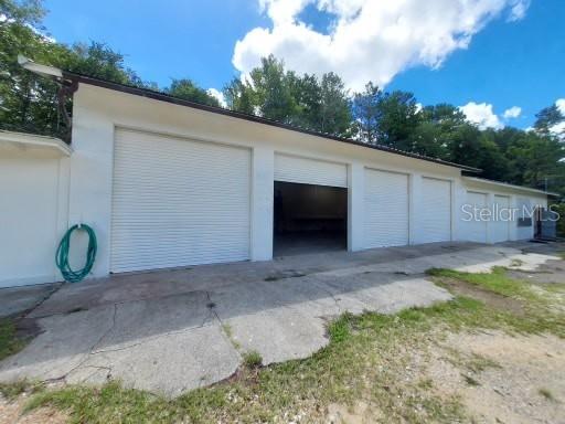 This versatile commercial property at 270 Fox Run Road, Keystone Heights, FL is a unique opportunity for business owners or investors. Located at the end of a quiet cul-de-sac on a dirt road, the building offers 3,120 square feet of space and is constructed of durable concrete block, built in 1979. Fully fenced compound with office space inside. Several bays located on the interior, ideal for automotive repair. This setting is ideal for light industrial use, storage, workshops, or a variety of commercial ventures. OWNER FINANCING is available, and the seller will also consider cash buyers or conventional financing. With solid construction and flexible purchase options, this property offers great potential. Schedule your tour today!