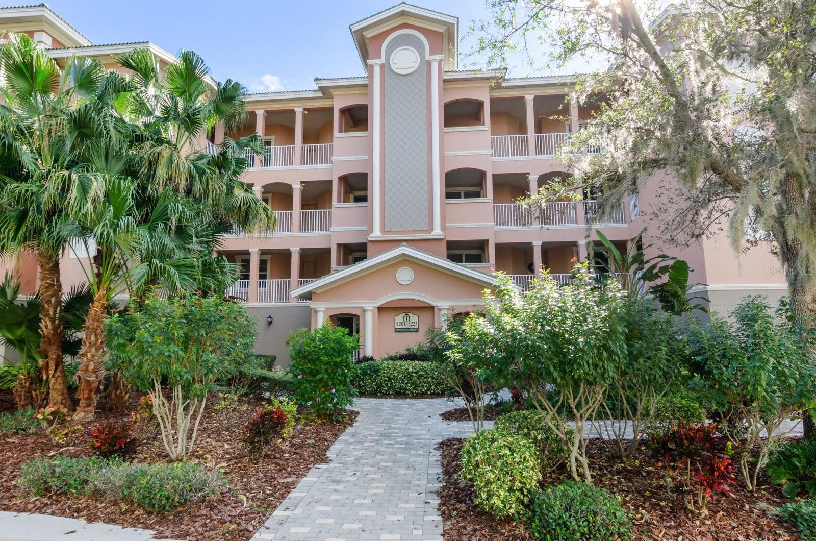 RARELY available FULLY FURNISHED, LARGE END UNIT, 3-bedroom, 3-bathroom, open floor plan with many features you will love! ADD in the impact glass sliders on the lanai overlooking the preserve and you have a total of 2727sq ft of living space! Kitchen is very bright with dining area with large windows overlooking sunny heated pool area and 2 hot tubs. Large inside laundry room has ample storage space, the ENTIRE home has so very much storage space for great organization! This is a must see if you are looking for a lavish gated community with walking paths, majestic oaks and a preserve with wildlife you will love to watch and relax. Some of the upgrades in this lovely home include high tray ceiling, crown molding, arched openings with columns, neutral tile, engineered hardwood flooring, TILE floors in the living room. The kitchen has granite countertops, a dine-in area and breakfast bar, custom wood cabinets with rollouts, built-in desk for convenient use such as cookbook use. The ensuite primary bedroom has a huge, customized, walk-in closet and a large bath with soaking tub, walk-in shower, dual sinks, and stone counters. There are two assigned parking spaces under the building and an extra air-conditioned, secured storage area. The community offers a fitness center, tennis courts and a clubhouse and heated pool and spa! You could walk to the UTC Mall, or Benderson Park with International rowing facilities. Access to I75 is so close! Downtown Sarasota, St. Armands Circle, for fabulous shopping, world famous Siesta Key beach and Lido Key Beach, cultural activities, numerous golf courses, and medical facilities. Come see and don't miss this beautiful home!