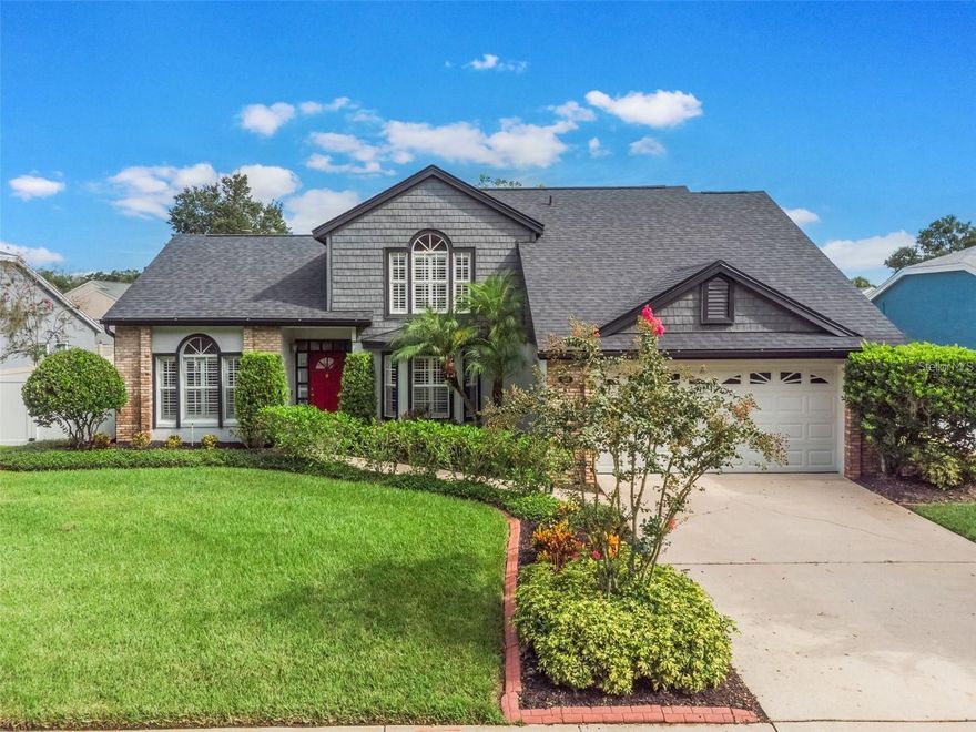 Meticulously maintained and beautifully updated, this stunning 4-bedroom, 2 full and 1 half bath home is nestled in a low-traffic, one-street neighborhood close to a golf course, parks, resturants and shopping. Zoned for top-rated Seminole County schools.

From the moment you enter, you’ll appreciate the bright, open floor plan, neutral color palette, knockdown ceilings, wide staircase, and abundant natural light enhanced by stylish window shutters. The spacious family room features soaring 12-foot ceilings and a handsome brick wood-burning fireplace, creating a warm and inviting focal point. A formal dining room with a charming bay window offers the perfect setting for gatherings and special occasions.

The thoughtfully designed kitchen boasts custom wood cabinetry with pull-outs, decorative glass display cabinets, tile backsplash, dual-basin stainless steel sink, microwave hood, cabinet pantry, and an eat-in island with barstool seating and additional storage — ideal for everyday living and entertaining.

The primary suite is conveniently located downstairs and features a spacious bath with dual sinks, a garden tub, an oversized walk-in shower with bench seating, private water closet, and an expansive walk-in closet with built-ins. Upstairs, you’ll find a second primary-style bedroom with a 7x8 walk-in closet, plus generously sized secondary bedrooms with double closets and ceiling fans throughout. The loft provides flexible living space perfect for a home office, reading nook, or play area, along with additional under-stair storage.

Enjoy year-round relaxation in the impressive 30x11 Florida/sunroom, cooled by a mini-split system with remote control. The inside laundry room includes newer washer and dryer, utility sink, and cabinetry for added convenience.

Major updates completed between 2023 and 2025 provide peace of mind, including a new roof, siding, interior and exterior paint (with accent walls), gutters, exterior lighting, refreshed bathrooms with refinished cabinets, new sinks and faucets, epoxy-coated garage floor with melamine shelving, new garage paint, new landscaping, and new washer, dryer, dishwasher, and microwave.

This move-in ready home offers space, style, and quality upgrades in one of Oviedo’s most desirable locations. Don’t miss this exceptional opportunity!