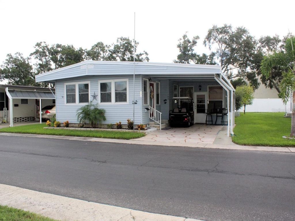Photo of 140 Pindo Palm Street W, Largo, FL 33770 (MLS # TB8425332)