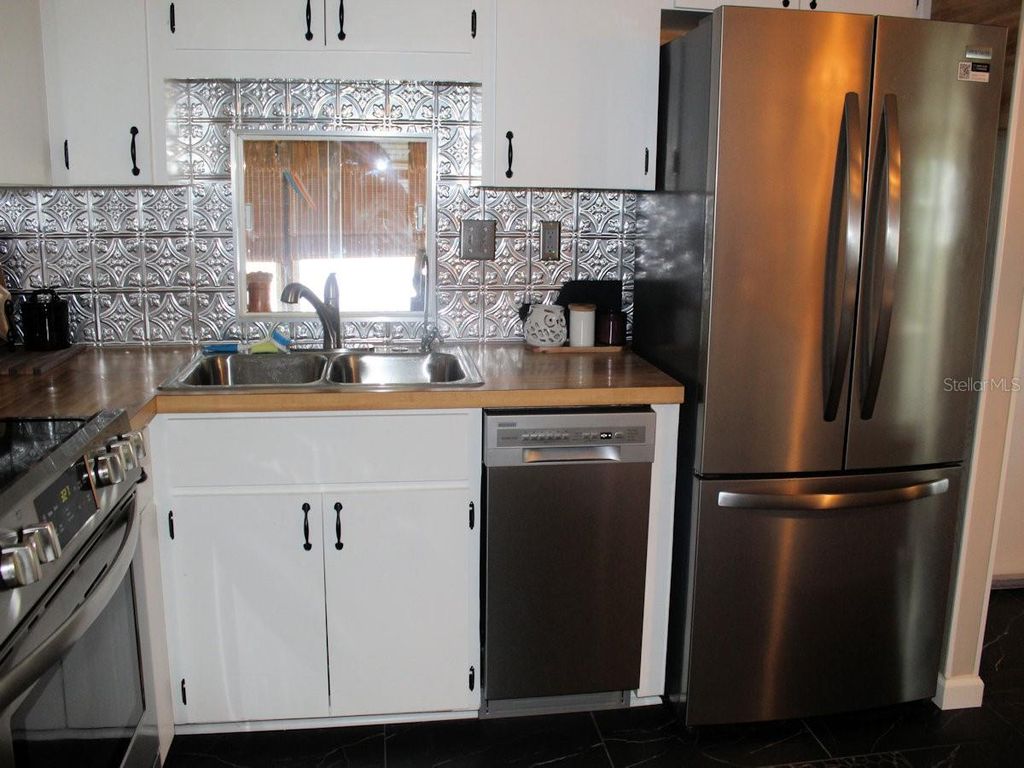 Photo of 140 Pindo Palm Street W, Largo, FL 33770 (MLS # TB8425332)