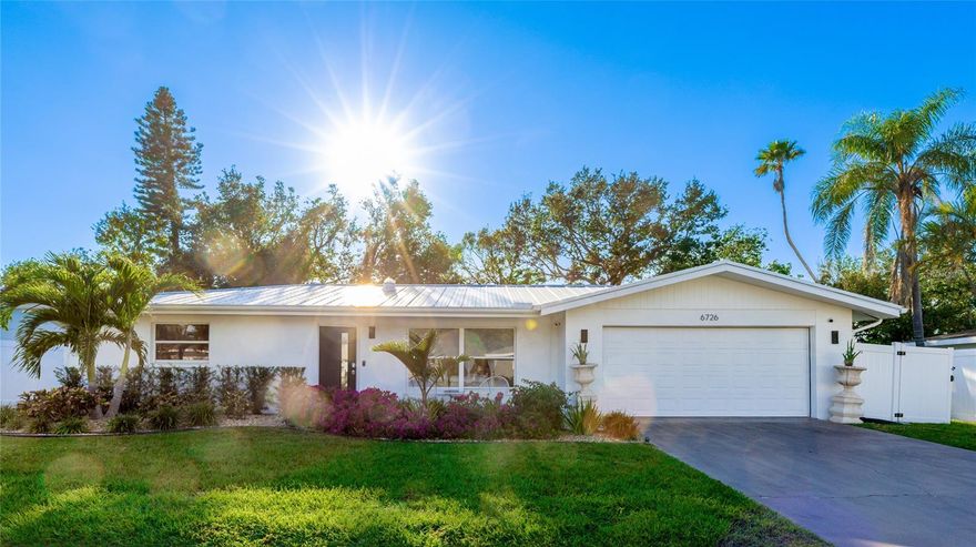 Welcome to this beautifully maintained 3-bedroom, 2-bath residence ideally located just minutes from the sugar-white sands of Siesta Key Beach. Situated on a generous ¼-acre lot, this home offers a rare combination of turnkey condition, thoughtful upgrades, and an exceptionally convenient Sarasota location.

Designed with ease of ownership in mind, this X flood zone property is highly insurance-friendly and offers long-term peace of mind, further complemented by a durable metal roof that enhances the home’s low-maintenance appeal.

The professionally landscaped front and backyard create a private, serene setting perfect for relaxing or entertaining. Inside, natural light fills the home, highlighting a functional and inviting layout. A spacious living and dining area flows into a secondary entertainment room that opens to the backyard, creating effortless indoor-outdoor living. Additional features include a screened-in lanai, dedicated laundry room, pantry, and an enclosed garage with excellent storage.

The kitchen offers ample cabinetry and storage, while both bathrooms have been tastefully renovated with modern finishes. Every detail has been carefully maintained, allowing a new owner to simply move in and enjoy their new home without the need for projects, updates, or delays.

The location further sets this home apart. Just minutes away are Publix, local restaurants, and the popular Gulf Gate dining district. The property is also near the highly anticipated Sarasota Square Mall redevelopment, anchored by Whole Foods and bringing over 530,000 square feet of new retail, dining, and commercial space, adding long-term value and everyday convenience. World-class golf courses and easy access to downtown Sarasota complete the lifestyle.

Whether you’re searching for a low-maintenance second home near the beach or a first-time purchase where everything is already done, this home checks all the boxes. A true move-in-ready opportunity in one of Sarasota’s most desirable and accessible locations.