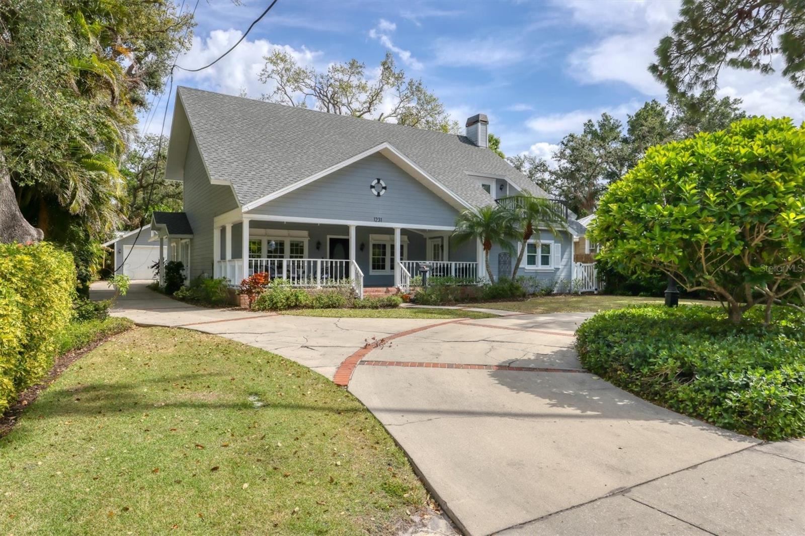 Assumable mortgage at 3.125% for qualified buyer! This meticulously updated 2,319-square-foot residence, at 1231 South Orange Avenue, offers a seamless blend of classic craftsmanship and modern convenience. The home was thoughtfully renovated in the 1990s, including addition of a second level to create an owner's retreat. Today, it is sporting a new 2025 roof. Featuring four spacious bedrooms and three baths, this home is ideal for those seeking a combination of comfort and style. As you step through the expansive front porch, the airy living room immediately impresses with its two-story vaulted ceiling, complete with an oversized fan and two skylights that flood the space with natural light. The adjoining dining area features oak wood floors and a unique elevated ledge for displaying artwork or cherished items. The professionally designed kitchen, recently remodeled, is a standout feature, boasting white shaker cabinetry, quartz countertops, full ventilation and high-end appliances including a KitchenAid oven, microwave and dishwasher. Thoughtful details such as soft-close drawers, a banquette with hidden storage, and custom lighting make this space functional and beautiful. The kitchen flows seamlessly into the den/family room, which includes a cozy wood-burning fireplace and easy access to the beautifully landscaped backyard. The outdoor space is a highlight, with a park-like setting, a brick patio and an outdoor shower for added convenience. Each bedroom opens onto a private balcony or patio, providing the ideal space to enjoy Florida’s warm climate. The second level, accessible via a custom circular stairwell, features a spacious owner’s retreat with dual walk-in closets and a private balcony offering views of Sarasota Bay, ideal for watching Fourth of July fireworks. The main bath has been tastefully updated with a large shower, double sinks and a skylight that brings in natural light. Additional amenities include a detached garage with attic storage. The home’s double-pane windows and 3M protective coating ensure peace and quiet, shielding the home from outside noise. In the desirable Seminole Heights neighborhood, this home is steps to Marie Selby Botanical Gardens, Sarasota Memorial Hospital and Southside Village, Southside Elementary School, Sarasota's downtown, medical facilities and shopping venues. With its combination of historical charm and modern upgrades, this home is an exceptional find in a sought-after location. Contact us today to schedule a private showing and make this exceptional property your own.