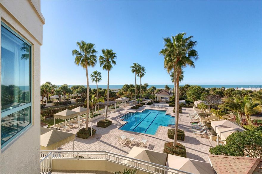 Your own private beach house without any of the exterior upkeep of an actual beach house!  The Grande  building on Sand Key. You will feel like you are in your own private beach house with an expansive wrap around terrace, two pools(one is a heated lap pool and one is a resort style pool) a very big hot tub, gas grill and gated beach access. This unit offers you a stunning, three bedroom, three bath home with 2521square feet of open living area, custom decorated with designer furnishings. You will have gulf views from all bedrooms.The home has a split plan with two bedrooms on one side and the primary suite on the other side. The home has everything you will need Including under building parking and temperature controlled storage.  You will enter the home to travertine floors in the entryway, kitchen, baths and hallways. Brand new berber carpetng in the three bedrooms and living room, upgraded cabinetry in kitchen and bathrooms,  to name a few amenities, His and her locker rooms complete with Steam, Sauna and Shower in each, newly remodeled work out rooms, 24 hour secured and gated guard house, concierge Monday through Friday, community rooms for parties and events including billiard room, reading library right outside your the doors to your new home.  Gorgeous full Gulf front unit, private elevator you share with your neighbor on you end of the building and Intracoastal views offering both sunrises and sunsets from this second floor beach elevation home. This end unit is one of only of two large units in the building that truly feel like a beach house.  Perfect home for entertaining. Come live the beach life today.  For your private tour contact the listing agent today.  Let me make life at THE GRANDE a Grand experience.