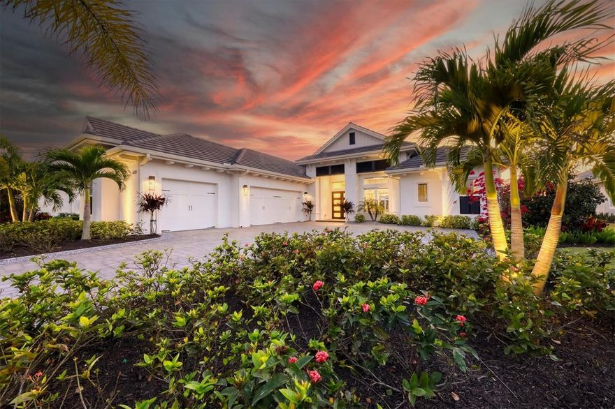 Nestled within the desirable Lake Club, along a private conservation preserve is this stunning Stock Merano true 4 bedroom and 4 bathroom home that has been graced with the impeccable custom design of LMG Design Consulting and Pizzazz Interiors. The high-end finishes and glamorous design evoke a magazine worthy level of luxury – the tailored features and opulent design have even been featured in Home & Design magazine. Step into this one-of-a-kind masterpiece and be impressed by admired wall finishes, elaborate ceiling detailing, a warm yet modern color palette, and lush Florida preserve views from the moment you arrive. Setting the stage from the iron and glass front doors, and the perfectly manicured landscaping, you are welcomed into a sophisticated foyer with 12’-13’ sloped ceiling, wall sconces and crisp textured wall. The same design flair is carried into the great room with a coffered ceiling, shiplap feature wall, display shelving with lighting, designer chandelier, and large pocketing impact sliding glass doors to create a seamless experience to the lanai. Evoking a resort-inspired retreat you’ll find relaxation on the lanai with coastal shellstone pavers, plentiful covered entertaining with tray ceilings, a cozy fireplace for chilly evenings, colonnade screen enclosure, and a massive outdoor kitchen outfitted with stainless steel appliances to delight any chef. Enjoy sunny afternoons in the heated saltwater pool and spa with PebbleTec finish, sunshelf, and water features. The sought after western exposure on the lanai offers delightful Florida sunsets over the preserve for paradise in your own backyard. There’s even space for four-legged family members in the fenced dog run on the side yard. Return indoors for more resplendent design including wood-look plank tile flooring, designer light fixtures, LED lighting, and solid core hardwood doors. The gourmet kitchen offers dynamic design with granite and quartz counters, a grand center island with counter-height seating, solid wood cabinetry with extra upper cabinets, custom built walk-in pantry, and a JennAir stainless steel appliance suite to create culinary masterpieces or weeknight dinners. Enjoy your meals in the adjacent dining area with custom ceiling finish that mirrors the great room and a wall of windows overlooking the lanai. The study with glass French doors and tray ceiling creates a private workspace. After a long day you can find sublime relaxation in the master wing with a vestibule entry, expansive bedroom with seating area and access to the lanai, and dual walk-in closets with custom shelving. Your master bathroom showcases a bright spa-like space with dual sinks amid granite counters, make-up vanity, large soaking tub, and walk-in shower with built-in bench. Guests will enjoy their own spaces with 3 true guest bedrooms and 3 guest bathrooms, two of which are en-suite. The back guest bedroom is also flexible as a bonus room or media room. Completing this fine residence is the laundry room with cabinetry and utility sink, and oversized side-loading 3 car garage that can fit all of your outdoor toys. Peace of mind is assured with a Generac generator, impact windows and sliding doors, whole home water softener, and security system. The Lake Club is a private gated community including a grande clubhouse, restaurant, pool, tennis, pickleball, playground, basketball, Linear Park, fitness center and interlinking lakes for kayaking or fishing. Room Feature: Linen Closet In Bath (Bedroom 3).