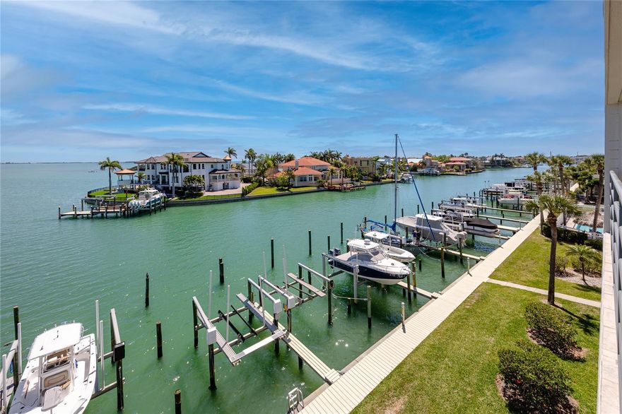 Experience refined waterfront living in this top-floor residence in desirable Tierra Verde’s Anchor Cove.This spacious residence showcases sweeping water views from the kitchen, great room, and primary suite, all opening to an expansive 9’ x 26’ balcony, the perfect place to relax and enjoy passing dolphins and coastal wildlife, complete with dual ceiling fans, a large storage closet, and electric hurricane shutters.Elevated ceilings and an open-concept design create a bright, airy atmosphere throughout the home.

The beautifully updated kitchen is thoughtfully designed with stone countertops, abundant wood cabinetry, premium KitchenAid appliances including a commercial-style steam/convection microwave and Superba convection oven, a pantry with pull-out shelving, breakfast bar seating, and a built-in workspace, ideal for both everyday living and entertaining.

The waterside primary suite offers stunning Tampa Bay views to start your day, while the en-suite bath features dual vanities, a spacious frameless glass shower, and two closets, including a walk-in.

Boating enthusiasts will appreciate the convenient access to the Intracoastal Waterway, Pass-a-Grille Channel, and the Gulf, with improved navigation via the Tierra Verde bridge.

Anchor Cove is a well-built, amenity-rich community offering a large waterfront pool and spa, two tennis courts, elevator access, covered tandem parking for two vehicles with additional storage, ample guest parking, and a pet-friendly policy. Ideally located on the island, you’re just minutes from Fort De Soto Park, St. Pete Beach, Pass-a-Grille, I-275, and vibrant downtown St. Petersburg, as well as nearby airports.

Enjoy the best of coastal luxury living with resort-style amenities, boating access, and beautiful open water views in one of Tierra Verde’s most sought-after communities.