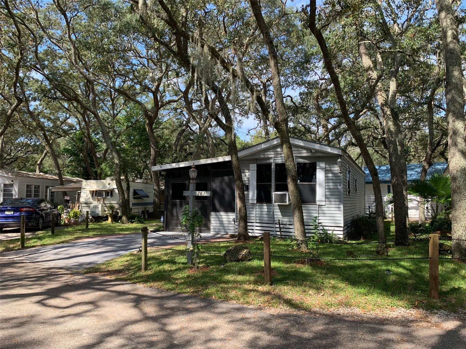 1 bedroom 1 bath park model home with large, enclosed Florida room. Ready to move in. Hardwood flooring throughout, new appliances, ceiling fans and fixtures. Parking for two in the front, open covered patio in the rear with utility shed. Rent includes water, sewer, trash pickup, 24/7 staffed gatehouse, 110,000-gallon Pool, On-Site Condo office and Management. This home is right off of Clarcona Rd with quick access to 441, 414, 436, 429, I4, Lake Apopka, Wekiva Springs State Park, shopping, dining, entertainment, and more!