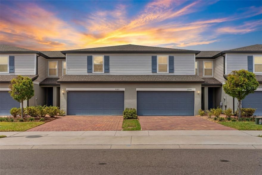 Seller may consider buyer concessions if made in an offer ~ Welcome to LOW MAINTENANCE LIVING done right in the Greens at Forest Lake in Ocoee – this 2021 BUILT townhome is absolutely immaculately kept and truly shows better than a model! MOVE IN READY with peaceful POND VIEWS and a desirable interior unit location, this home also offers an ASSUMABLE FHA LOAN – an incredible opportunity in today’s market. Recent updates shine, starting with 2025 UPGRADES including WHITE OAK LUXURY VINYL PLANK flooring throughout (no carpet!), INTERIOR PAINT touch-ups, decorative paneling under the kitchen island, a WATER SOFTENER/FILTRATION SYSTEM, and ceiling fans throughout (including the garage!). In 2024, the home was enhanced with updated kitchen and bathroom hardware along with stylish pendant lighting, and in 2023, a modern kitchen backsplash was added – creating a fresh, cohesive look that feels current and elevated. Step inside to a light, bright OPEN CONCEPT layout designed for both everyday living and easy entertaining. The kitchen is the heart of the home, featuring a large ISLAND with bar seating, granite countertops, STAINLESS STEEL APPLIANCES, pendant lighting, and a clean, modern color palette – all flowing seamlessly into the living and dining spaces. Sliding glass doors lead to the patio where you can unwind and take in tranquil WATER VIEWS. The main floor also includes a convenient half bath, while upstairs offers a smart SPLIT BEDROOM layout for added privacy. The PRIMARY SUITE features a WALK-IN CLOSET and a private en-suite bath, while bedrooms two and three are positioned on the opposite side and share a second full bath. A second-floor laundry room adds everyday convenience. Outside, you will appreciate the paver driveway, attractive landscaping, and nearby guest parking. Residents of Greens at Forest Lake have access to community amenities including a POOL, playground, and walking trails, all just minutes from Publix, shopping, dining, and with easy access to SR-429 and Clarcona Ocoee Road for commuting anywhere in Central Florida. If you have been waiting for a townhome that truly stands out in condition, style, and location – this is it. Call today to schedule a tour!