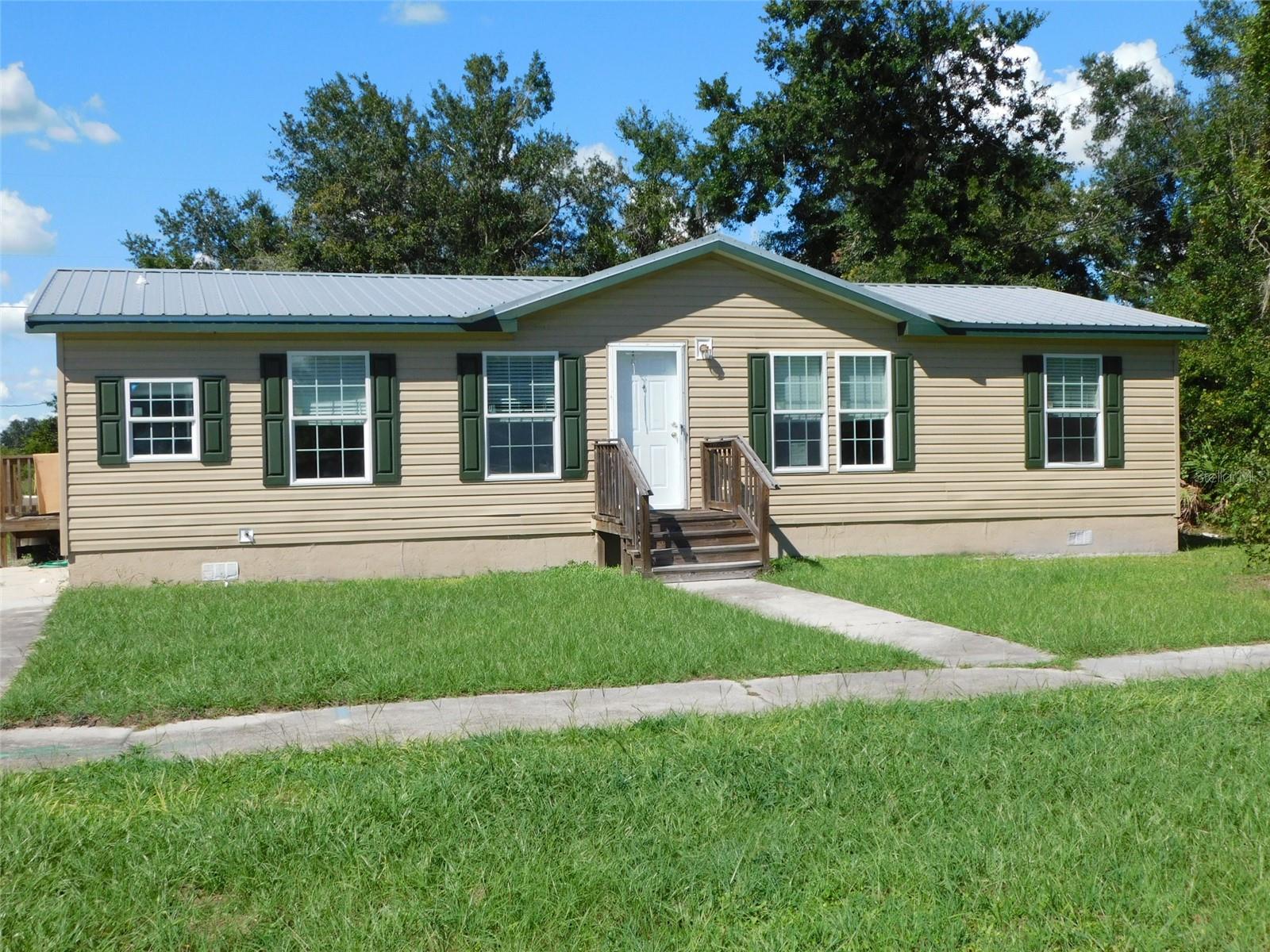 JUST ABOUT 1300 SF OF LIVING AREA. NEWLY REMODELED HOME WITH ALL NEW INTERIOR AND EXTERIOR PAINT. NEW METAL ROOF. NEW LTV FLOORS THROUGHOUT THE HOUSE. LAUNDRY CLOSET OFF OF THE BREAKFAST ROOM. KITCHEN HAS A BREAKFAST BAR, NEW COUNTER TOPS, ALL NEW PAINT, PANTRY, DRAWERS FOR POTS AND PANS. NEW APPLIANCES ARE COMING SOON. THREE BEDROOMS, SPLIT PLAN. HALL BATH HAS A HALL LINEN CABINET. PRIMARY BEDROOM HAS A CLOSET ACROSS ONE SIDE OF THE BEDROOM. DOUBLE DOORS INTO THE PRIMARY BATHROOM THAT HAS DUAL SINKS, WALK IN LARGE SHOWER, EVERYTHING IS NEW IN THE BATHROOM. SIDEWALK IN FRONT OF THE HOUSE. WATER SHUT OFF HAS BEEN INSTALLED. FRONT AND SIDE WOOD DECK PORCHES.