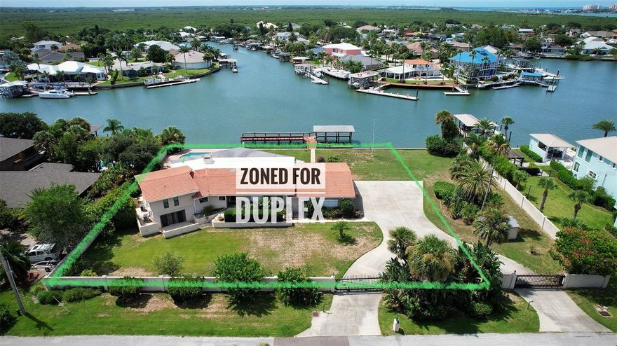 WONDERFUL OPPORTUNITY TO KEEP THE HOME OR BUILD NEW. LOT IS ZONED FOR A DUPLEX AND OWNER IS RETAINING 67 FEET ON THE EAST SIDE MAKING THE LOT 142.76X184 and approx 150 FEET ON THE WATER. SHOULD BUYER ELECT TO KEEP THE HOME THE GARAGE WILL NEED TO BE CONVERTED TO DOORS FACING EAST CIRCLE. ALL NEW AC SYSTEMS AND LOTS OF UPGRADES IN THE LAST FEW YEARS. NEWER KITCHEN AND BATHROOMS IN 2013.SPRAWLING AND SPACIOUS WITH VIEWS OVERLOOKING THE POOL AND THE RIVER RIGHT NEXT TO THE INTRACOASTAL. LOVELY BAR AREA AND FIREPLACE. HOME FEELS LIKE A FORTRESS. BUILT IN 1963. SPLIT LEVELS IN THE HOME WITH THE MASTER ON THE UPPER LEVEL. POSSIBILITY FOR AN INLAW SUITE ON THE FIRST LEVEL WITH ITS OWN ENTRANCE. SUNKEN BAR AREA OVERLOOKING THE RIVER. TILE ROOF. OPEN PLAN WITH A HUGE LANAI IN THE BACK WITH ITS OWN MINISPLIT AC SYSTEM. ROOMS SIZES ARE APPROXIMATE AND MUST BE VERIFIED BY THE BUYER. THE PROPERTY IS ZONED MULTI-FAMILY. COME BUILD YOUR DREAM HOME OR PERFECT FOR A DEVELOPER FOR INVESTMENT ;Water: City