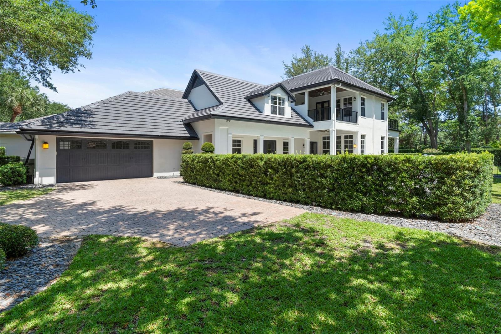 This beautiful pool home has a new tile roof with transferable warranty and it sits on an oversized corner lot in the well-known gated community of Lake Nona Golf & Country Club, which is admired by many golf lovers including top players and legendary professionals. This home offers oversized double master suites on the first and second levels overlooking the wide courtyard. Both have a spacious bedroom, luxury full bathroom, and oversized walk-in closets. There is a large living room with custom shelves on the first floor with the covered back porch and big yard There is a large game room with two balconies facing the wide courtyard on the second level. One is covered and overlooking the private pool with spa while the other is overlooking the courtyard from the second level. The 3rd bedroom on the 2nd floor has a full bathroom and a spacious walk-in closet. The kitchen with marble countertops & backsplash is equipped with the gas stove, double ovens, microwave, hood, oversized refrigerator, wine cellar, extra refrigerator and freezer, big sink with disposal, dishwasher, and pantry. The Dining room is off the kitchen and invites the guests on the pool deck by the courtyard entry for fun gatherings. The brick driveway leads to a two car garage with an additional golf-cart storage space as well as to the courtyard entrance by the pool deck. Two HVAC systems were upgraded entirely in 2023 with UV air quality enhancement, whole home duct cleaning, and sanitizing. Water supply pipes were re-piped to PEX "A" type in 2024 to ensure the healthy living.