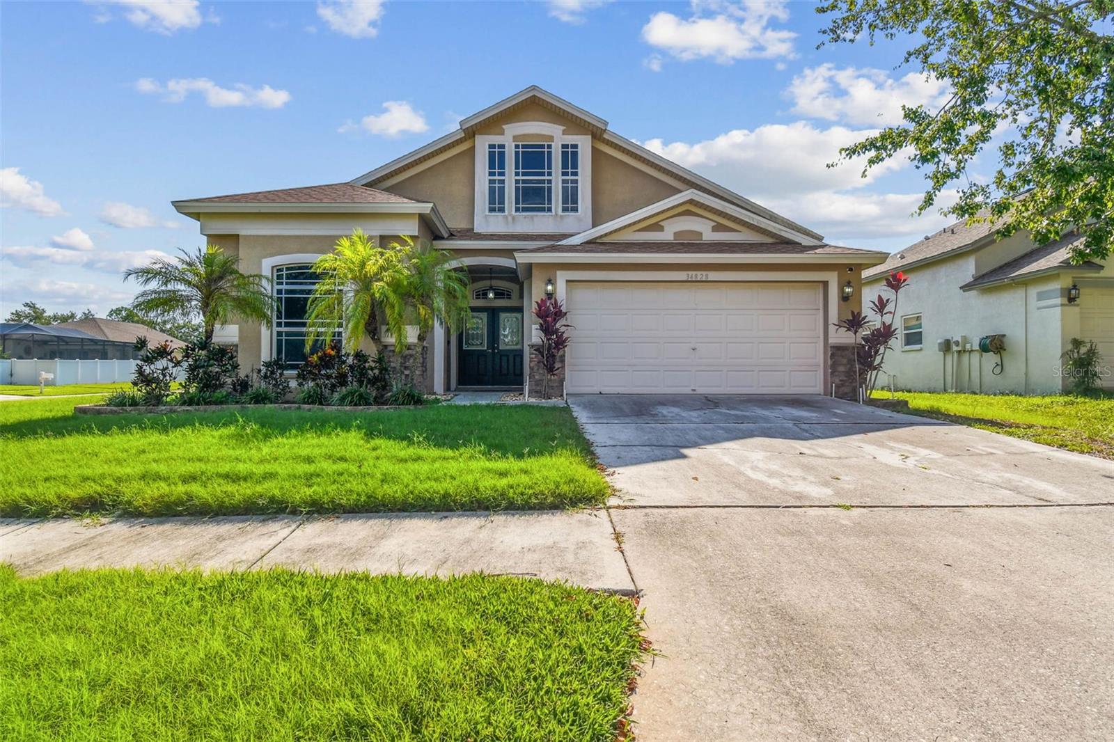 Welcome to 34828 Prairie Ridge Way – Spacious Living on a Corner Lot in Lake Bernadette!
Located in the highly desirable Lake Bernadette golf course community in Zephyrhills, this well-maintained 4-bedroom, 2-bathroom home with a versatile bonus room offers the perfect blend of comfort, functionality, and lifestyle.
Step inside to discover an open-concept layout filled with natural light, vaulted ceilings, and neutral finishes throughout—creating a warm and welcoming atmosphere. The kitchen features stainless steel appliances, abundant cabinet space, and a convenient center island, making it ideal for everyday living and casual entertaining.
The split-bedroom floor plan offers privacy and flexibility, with the primary suite featuring a spacious walk-in closet and en-suite bath complete with dual sinks, garden tub and a walk-in shower.
Enjoy outdoor living on the covered patio or take advantage of the spacious corner lot—perfect for gardening, play, or future personalization.
This home is just minutes from shopping, dining, medical facilities, and top-rated schools, with easy access to major roadways for smooth commuting. You'll love the lifestyle that comes with living in this established golf course community—featuring pools, a clubhouse, tennis courts, playgrounds, and more—all with a low HOA and a wide range of amenities to enjoy.
Don’t miss the opportunity to own this move-in ready home in one of Zephyrhills’ most established and amenity-rich communities. Schedule your private tour today!