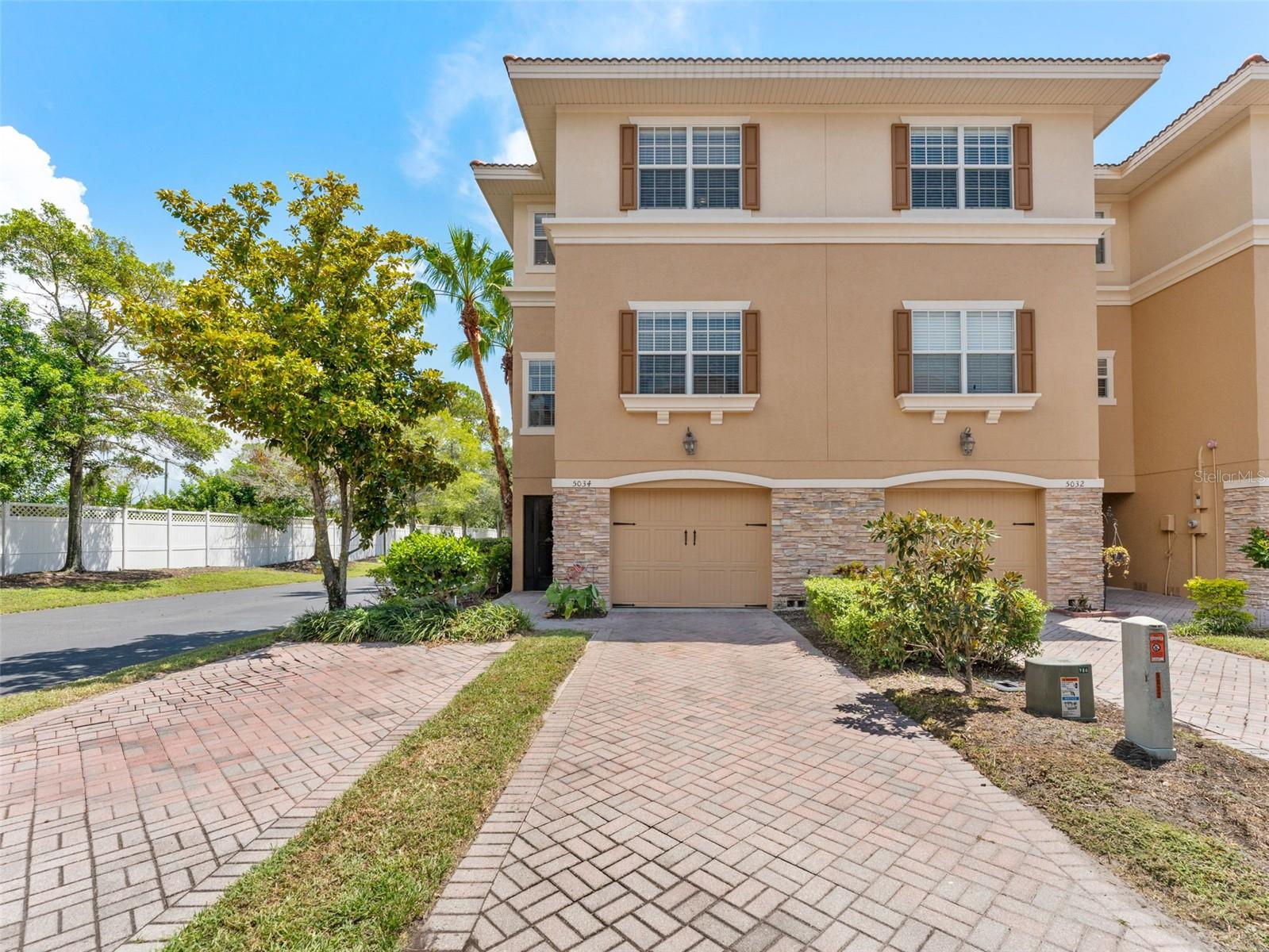 Welcome to 5034 Blue Runner Ct, a sophisticated end-unit townhome in the highly sought-after gated Sea Forest Beach Club community of New Port Richey. Boasting three bedrooms and three full baths across three levels, this residence features two true primary suites with walk-in closets—ideal for guest accommodations, multi-generational living, or simply added flexibility.
The thoughtful layout begins at the ground level with a one-car garage and two storage spaces—one generously oversized—to store gear, seasonal items, or household extras. A private elevator offers effortless vertical access, while stairs are also available for those who prefer to stretch their legs.
Enter the second level to find an open-concept living experience. The kitchen, updated in 2020, includes granite countertops and stainless steel appliances—dishwasher (2023), refrigerator (2024), microwave (2025)—all anchored by beautiful wood flooring (no vinyl here) and neutral tile in the kitchen and baths. A clean lanai with newly refreshed flooring (2023) and a maintenance-free backyard round out the bright living space.
Upstairs, both en suite bedrooms offer privacy and convenience. Major system updates include a new AC (2022), water heater (2023), and the elevator was professionally inspected in 2025. Importantly, the home has no living-space hurricane damage, offering peace of mind.
Residents enjoy exceptional amenities—two community pools (one heated), fitness center, dog park, and private beach club access—all included in the HOA of just $265/month, which also covers exterior building maintenance, trash, and more.
This home offers refined comfort, smart upgrades, and a vibrant, amenity-rich lifestyle—all in a quiet corner setting with convenient access to US-19, shopping, dining, and beyond.