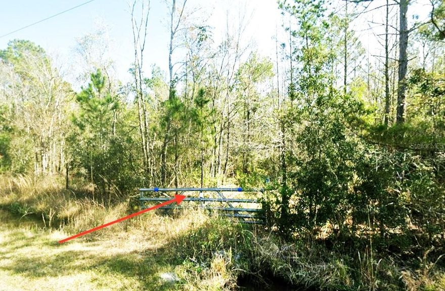 Amazing opportunity to own a 1.14-acre high and dry lot in the growing community of Flagler Estates, Hastings, FL. This property features a culvert and gated entrance, giving you immediate access to your own private slice of Florida country living. With no HOA, no CDD, and no deed restrictions, you’ll enjoy the freedom to bring your boats, RVs, toys, and animals with plenty of room to spread out.
Zoned Open Rural (OR), this parcel is ideal for a site-built, modular, or manufactured home and offers ample space for a workshop, garden, or outdoor storage. Electric is available. Enjoy peaceful rural surroundings while still being conveniently located near the St. Johns River, St. Augustine, Palm Coast, and beautiful area beaches.
Outdoor enthusiasts will love the easy access to boating, fishing, and nature excursions, all just minutes away. Experience quiet country living with the flexibility to build on your own timeline. Drive by and see the potential !!!