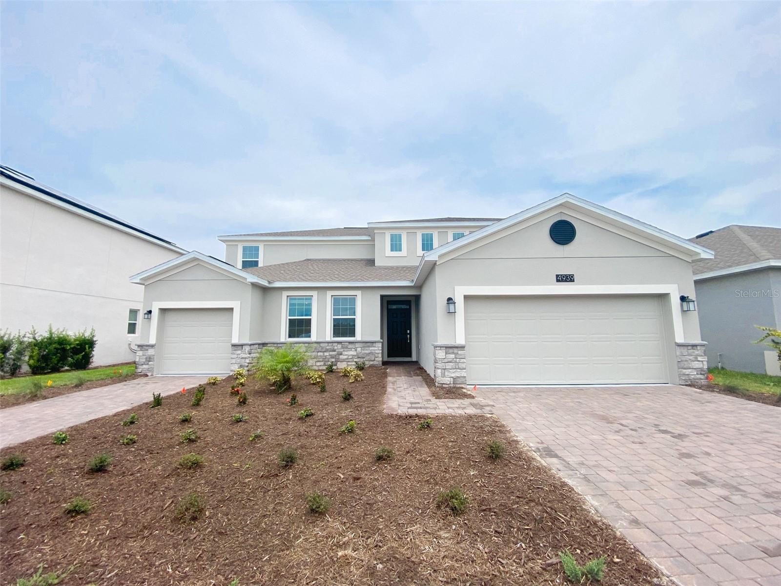 Beautiful modern home built in 2023, located in the highly sought-after Hanover Lakes community — just minutes from Lake Nona, Medical City, and major highways! This spacious two-story home offers 5 bedrooms, 3.5 bathrooms, and a 2-car garage, combining contemporary design with comfort and functionality. The open-concept layout features a bright living and dining area that flows seamlessly into the kitchen, complete with stainless steel appliances, quartz countertops, a large island, and plenty of storage space. The primary suite offers a peaceful retreat with a generous walk-in closet and an ensuite bathroom with dual vanities and a walk-in shower. Upstairs, you’ll find additional bedrooms and a versatile loft area perfect for a media room, playroom, or home office. Enjoy Florida living at its best in Hanover Lakes — a waterfront community where boating, fishing, and nature are part of everyday life. Residents have access to an incredible array of amenities, including a private community boat dock and lift with access to the Chain of Lakes, a resort-style pool, splash park, cabana, and scenic walking trails. This home perfectly balances modern living with a relaxed lifestyle in one of Central Florida’s most desirable locations. Energy-efficient living with solar panels — the solar fee is conveniently included in the rent.