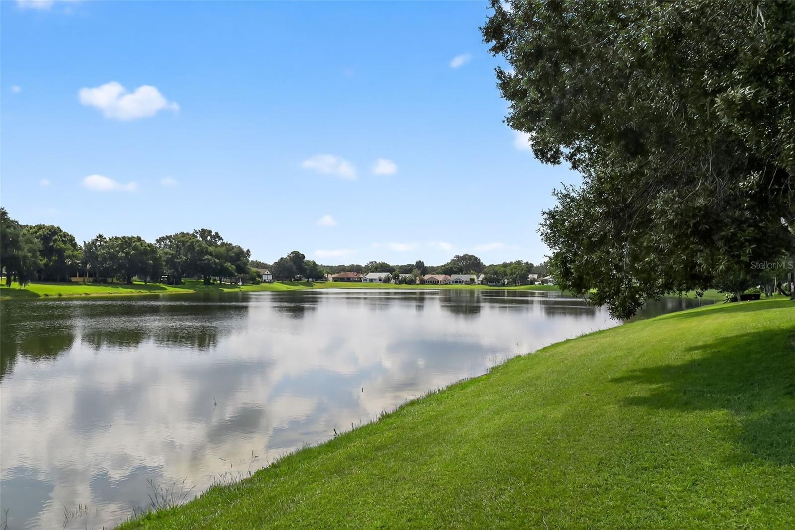 Beautiful waterfront San Marino turned modern open concept home. Bismarck palm tree front, 2 majestic oaks back. Re-roofed in 2025 with premium CertainTeed Landmark Pro shingles, all drip edges also replaced. Fresh new paint for the house exterior. Front door opens to 27 x 22 living room with fabulous lake view. The lake view can be seen in the kitchen, living room, and master bedroom. The second and third bedrooms in opposite corner to the master bedroom to ensure maximum privacy. Kitchen counter and backsplash are covered with premium Copacabana granite. All bathrooms also have Copacabana granite counters. Most appliances were recently upgraded: purchased in '23 LG dishwasher and Samsung range oven have never been used. LG refrigerator purchased late '23. Samsung washer and dryer in '21 and '22. Master bathroom shower upgraded with corian walls and rimless glass door. Entire house floor covered with Tasmania premium imported polished porcelain. Kitchen floor has ceramic tile.