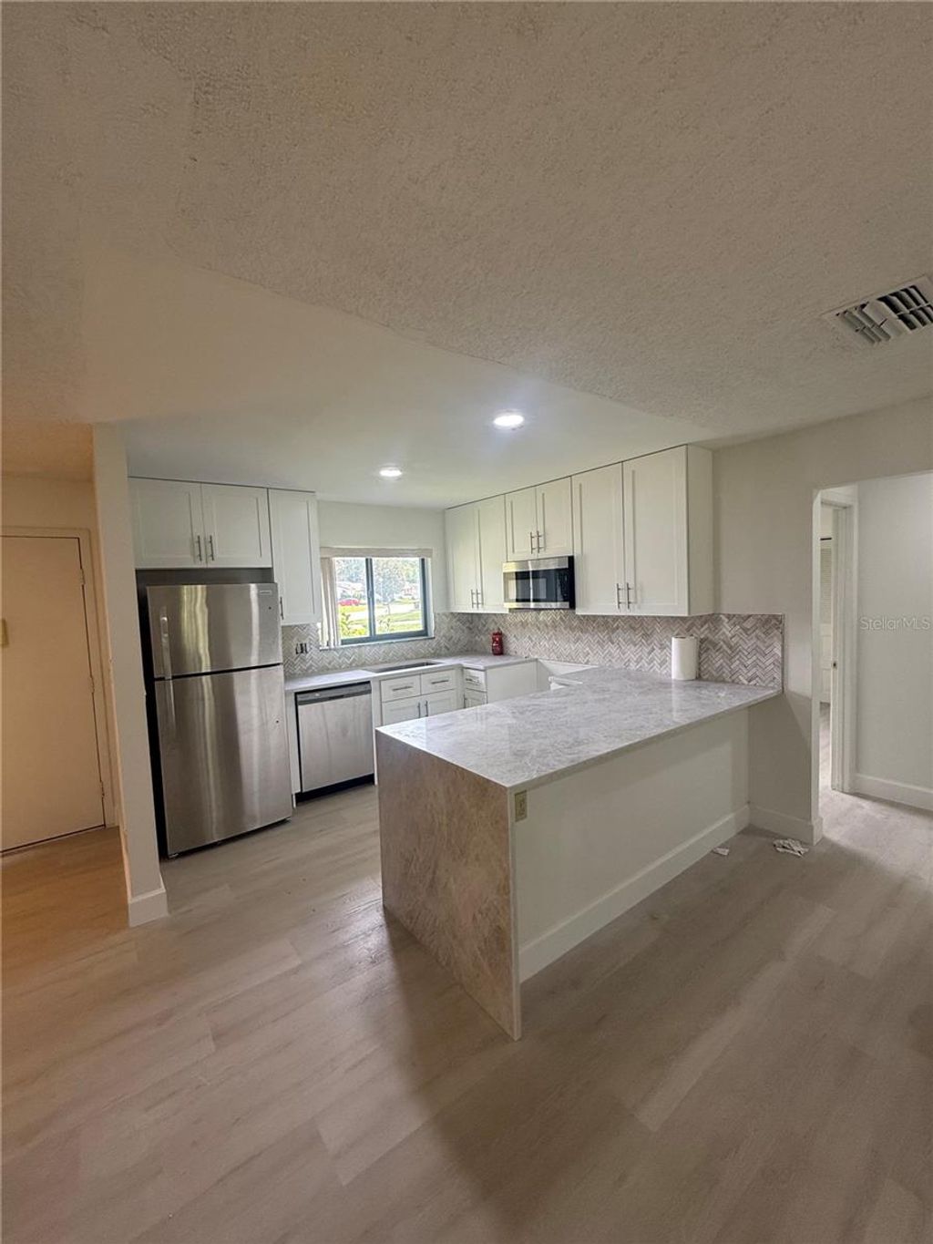 Photo of 10719 Lazy Lake Drive, Orlando, FL 32821 (MLS # O6419682)