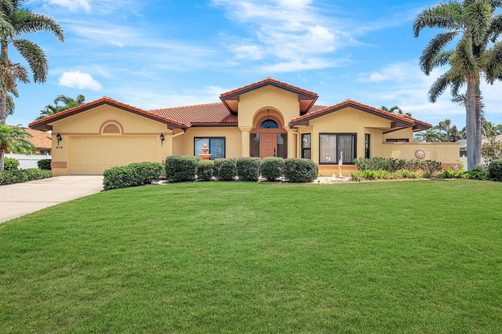 Spacious Pool Home on Oversized 3-Lot Site in Central Cape Coral is ready for a new family! With 3,127 sq ft under air, this well-designed home offers plenty of space to spread out, featuring 3 large bedrooms, 4 bathrooms (including a convenient pool bath), and two separate living areas —perfect for entertaining or multi-generational living. The kitchen is equipped with granite countertops, wood cabinetry, a prep island, and breakfast bar seating for casual meals. Owners suite features private entry to lanai, 2 HUGE walk in closets, soaking tub, walk in shower, dual sinks PLUS it has a attached room perfect for office, exercise, meditation or baby room! Enjoy added peace of mind with impact windows, a new tile roof (2018), and a fully fenced 6-foot privacy yard. This home sits on a HUGE 3-lot site, offering rare outdoor space in a prime location with gorgeous landscaping, decorative curbing and multiple palm trees. Outdoor living features large chlorine pool, covered sitting area and plenty of sunning space. While the home is structurally solid and packed with potential, it could use a little cosmetic TLC to make it truly shine. Don’t miss the opportunity to customize this Cape Coral gem to your taste and make it your own! Agents see comments.