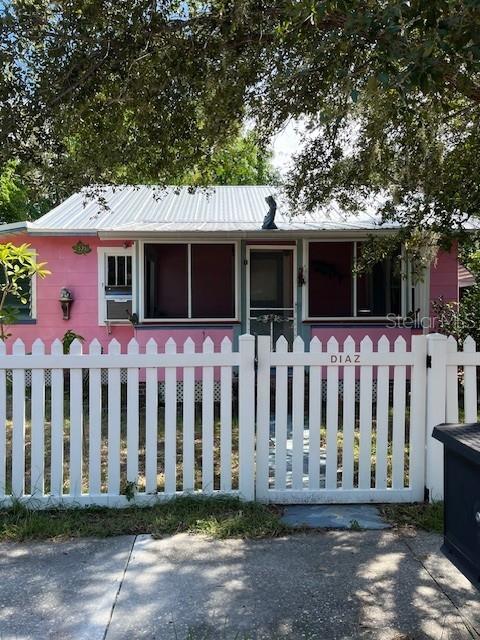 Historic Home in Dunedin! Charming 2 bedroom, 1 bath, wood floors, eat in kitchen, big fenced in yard with outside patio! Steps to beautiful downtown Dunedin! Enjoy the restuarants, shops, parks, museums and waterfront! Window AC's and inside washer & dryer. Find your peace here!