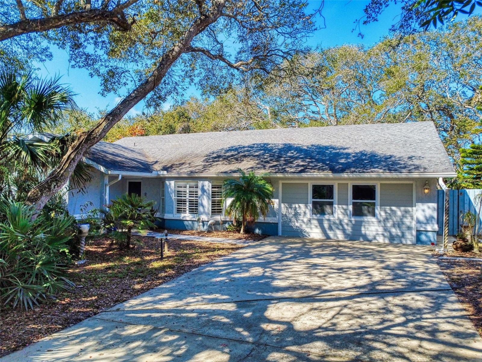 This spacious and versatile 5-bedroom, 2-bath beachside bungalow with a bonus room offers flexible living and sleeping spaces throughout. Situated on an oversized 75x150 lot, the home features a private fenced backyard, lush tropical landscaping, a large screened-in patio, and two additional outdoor patios perfect for entertaining.
Inside, enjoy cathedral ceilings, an open layout, a split-bedroom floor plan, and a bright, cheerful coastal vibe. The great room, family room, and upstairs bonus room provide multiple gathering spaces, while one guest room includes custom-built bunk beds that sleep four.
Located within walking distance to the sparkling ocean, Callalisa Creek, and the excitement of Flagler Avenue and historic Canal Street, this home truly puts the best of New Smyrna Beach at your doorstep. If you're looking for a homey beachside gem, this is your chance for a little slice of paradise. Pets considered. Schedule your private showing today!