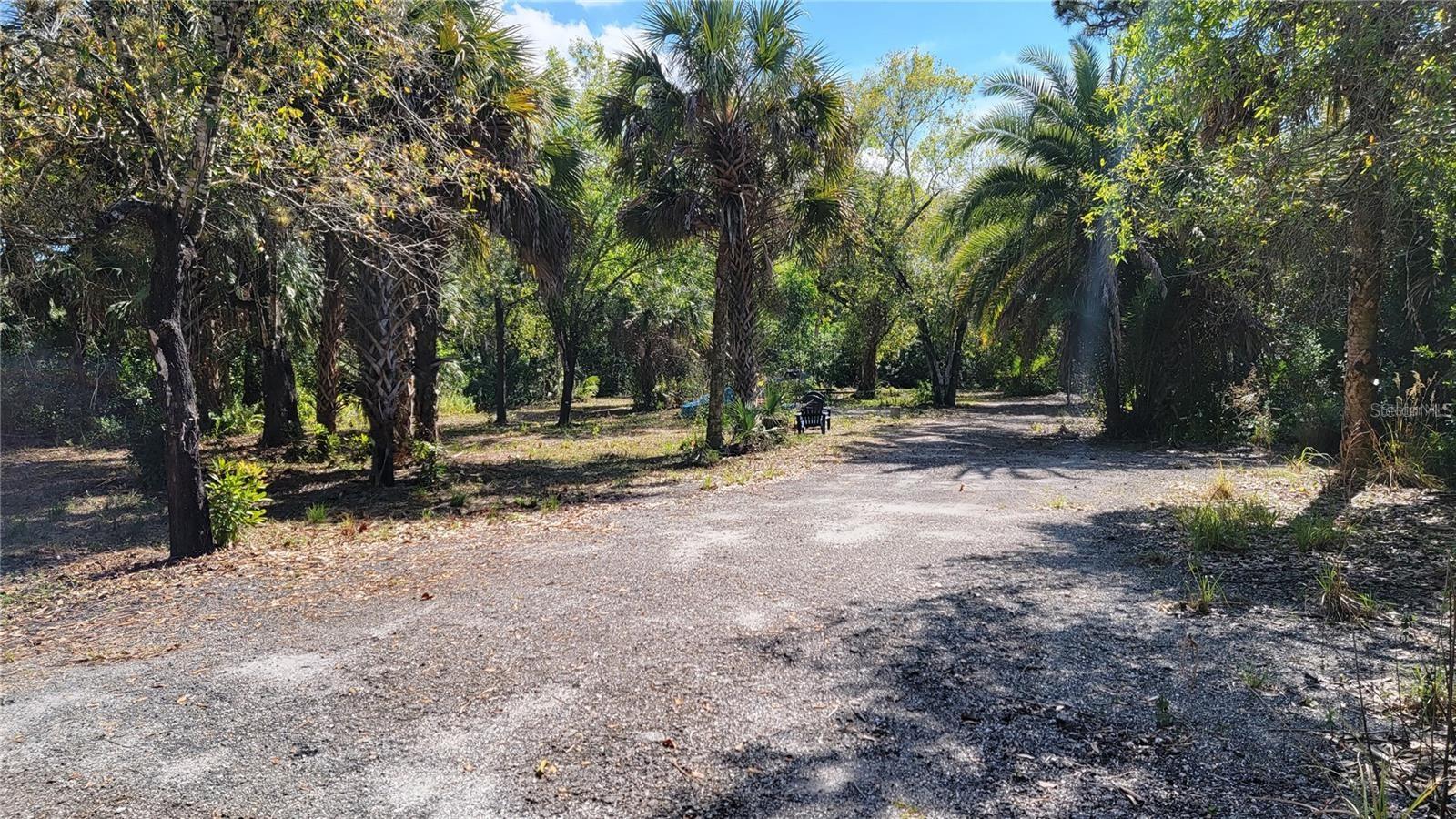 SELLER WILL CONSIDER EXCHANGE/TRADE OR OWNER FINANCING ON THIS NEARLY AN ACRE OF COMMERCIAL LAND WITH ENDLESS POSSIBILITIES: Located in the rapidly growing city of Punta Gorda, this expansive plot boasts nearly an acre of commercial property zoned OMI with flexible uses. Already partially cleared with fill dirt added the property showcases two entrances, a central road base consisting of asphalt millings and ditches for proper drainage. Currently combined into one large parcel, the site is made up of FOUR combined plotted lots. Per the Seller the property is grandfathered into multifamily use and can easily be developed into 8 rental units if desired. Additional uses for OMI include medical, office and institutional. Surrounded by properties zoned Commercial General the parcels per the Seller can be approved for rezoning to CG that allows for countless uses including storage facility, RV park, outdoor storage, warehouse, hotel, restaurant etc… Centrally located across from the famous Fat Point Brewery, the property is 1.2 miles off of the interstate as well as 1.5 miles from downtown Punta Gorda offering fine dining, nightlife, Harbor views, walking trails and shopping. Punta Gorda airport is less than 3 miles from the property providing convenience and extremely affordable travel arrangements. This is a one of a kind opportunity that will not last long.