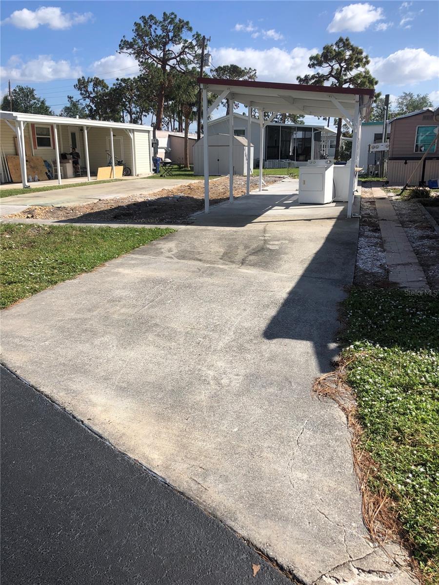 Wonderful "Old Florida" community close to beaches, dining, shopping. If you are looking to become part of a fun loving slightly old fashioned park, this is it. Play cards , do a puzzle, or share coffee in the community building. Enjoy the heated salt water pool. Side walks outside the park connect you to the village of Englewood and all the doings on West Dearborn; The Moose Lodge, fabulous farmers market, blues club, antique car rallies, Vino Loco wine bar, boutiques and art galleries.
The home was damaged in Ian and scraped leaving the perfect spot for your new home. There is an existing carport ( 12x44')with concrete slab, storage shed ( 10x8')and area for a screen room or lanai( 10x38'). The original home was 12'x60'.
Please note that all land is owned by corporation and there are no lot lines. Set backs are generally the URL fire code, except for the 10' road setback.