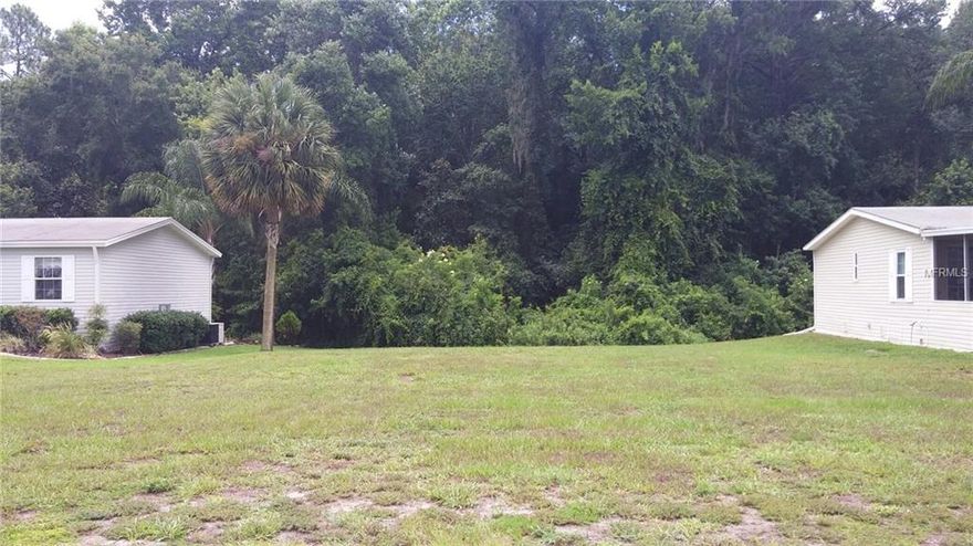 BEUTIFUL LOT IN GATED GOLF COMMUNITY!!! NO NEIGHBORS BEHIND YOU, PRIVATE BACKYARD, WOODED AREA VIEW, VERY ACTIVE COMMUNITY, NEAR THE VILLAGES, SHOPPING, DANCING AND DINING,  COME SET YOUR NEW HOME HERE... CALL TO VIEW THIS PROPERTY, PRICED TO SELL, WONT LAST LONG...