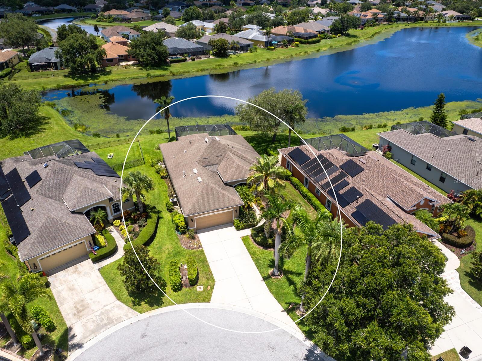 Welcome to Greyhawk Landing - Where Lifestyle and Location Meet... Located in a gated community, and on a cul-de-sac, you'll find this well-designed POOL home. Featuring Lake views, vaulted ceilings and plenty of natural light throughout the over 2000 sq ft of living space. The layout provides 3 bedrooms, 2 bathrooms, formal living, formal dining, a breakfast nook with views of the lake, a family room with access to the screened in POOL area and an indoor utility room complete with a wash sink wine refrigerator and extra cabinet space. The kitchen includes a gas cooktop, stainless appliances, tile backsplash, walk-in pantry, tall cabinets and breakfast bar open to the family room. The primary bedroom offers access to the outdoor living space, walkin closets, a large en suite bath with soaking tub, walk-in shower, dual sinks, and a vanity space. Greyhawk Landing has low HOA fees ($75/year) and a wide range of amenities: two lagoon-style pools, fitness center, tennis and pickleball courts, basketball courts, playgrounds, fishing, sports fields, and over five miles of walking/biking trails. Located near Bradenton's top beaches, golf courses, shopping, dining, and recreation, this is a great opportunity to live in a sought-after location. Schedule your private showing today!