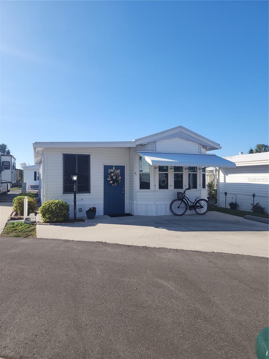 Sarasota Lakes RV is an oasis of resort style living!! The gated community has swimming, tennis, shuffle board, pickle ball and a playground. Plenty of community activities. This lot can be used for personal use or rental. LOW Maintenance Fees. Updated 1 bedroom 1.5 bath Park Model with addition. Fully furnished with laundry room, storage and golf cart. On site management. Perfect location close to beaches and St Armand Circle.