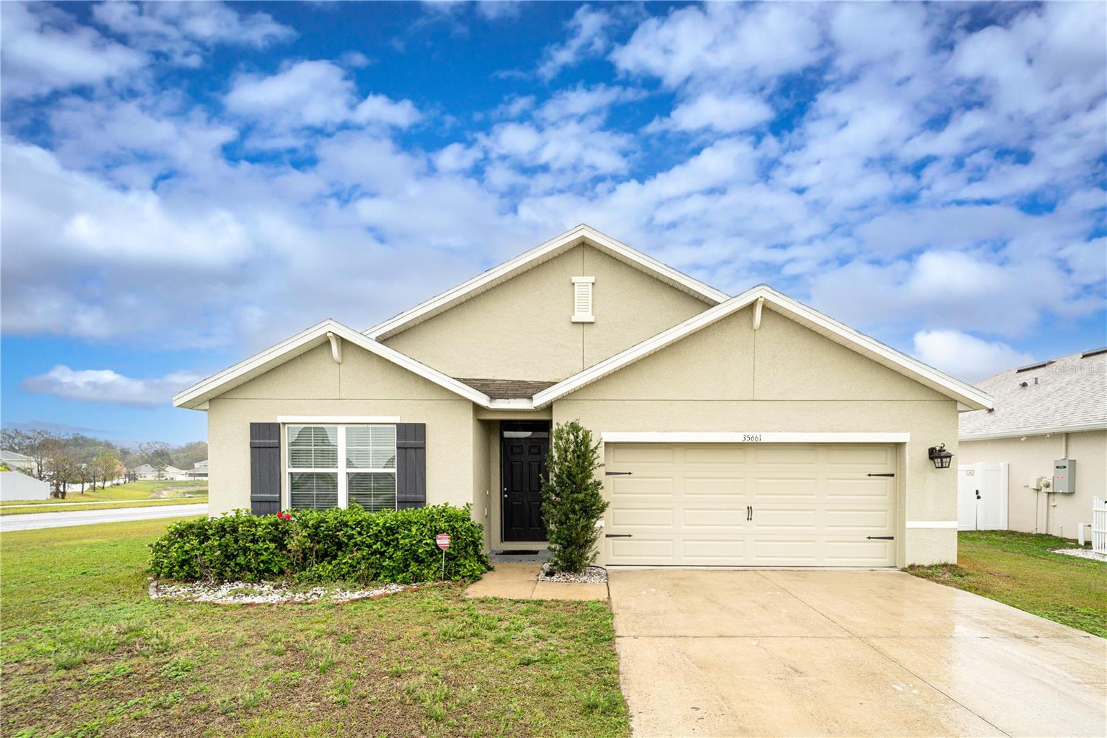 Welcome to your new home in the Zephyr Ridge community! This charming 4-bedroom, 2-bathroom residence features a brand new roof (2025) and a spacious open floor plan with neutral tones throughout. Enjoy plush carpeting in the bedrooms and elegant tile and wood flooring in the living areas. The stylish kitchen boasts a modern backsplash, island with breakfast bar, and walk-in pantry, perfect for both daily living and entertaining. The private owner’s suite offers serene conservation area views and an ensuite bath with dual vanities, a walk-in shower, and linen closet. Step out onto your back patio to unwind with peaceful views. Conveniently located near a variety of local amenities, school, shopping, dining, and entertainment. Seller is motivated so don’t miss out! Schedule your showing today!