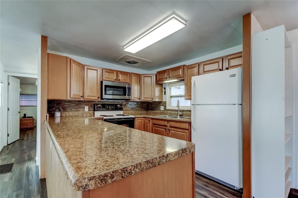 Photo of 7 Drury Lane, Tarpon Springs, FL 34689 (MLS # TB8451969)